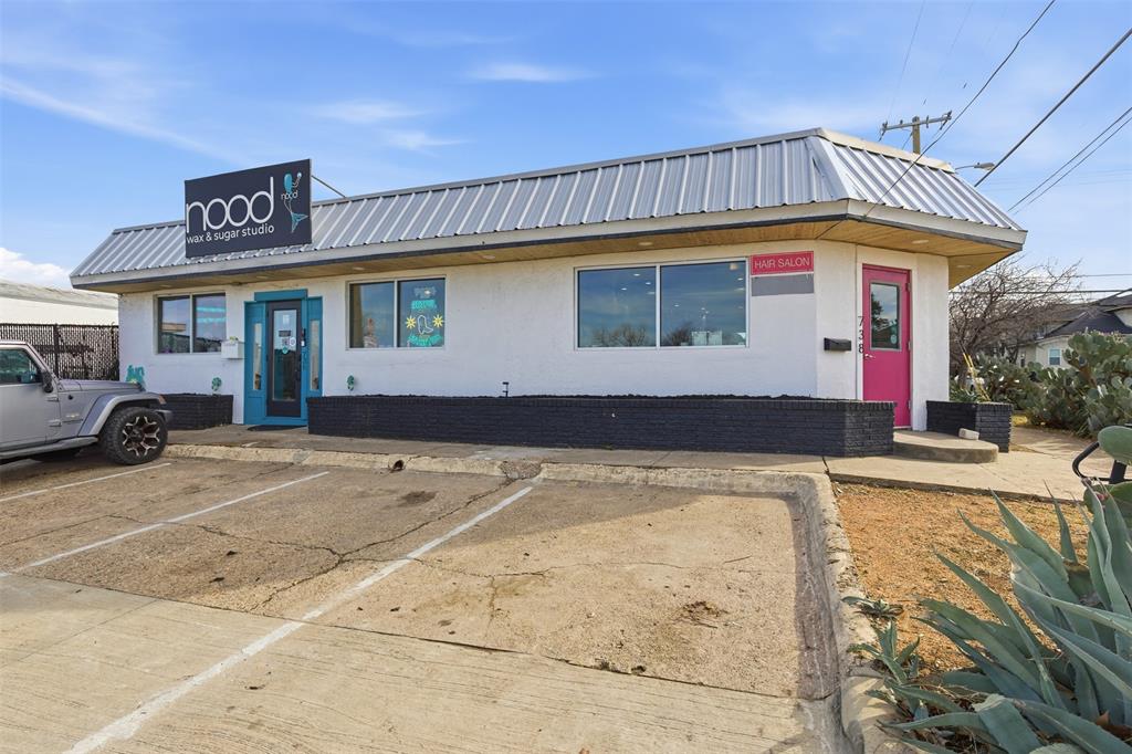 Exceptional commercial opportunity, in a phenomenal spot adjacent to both Bishop Arts District and TyPo. Recently approved multi-story development across W Davis will only increase the value of this location with additional street and pedestrian traffic. This freestanding corner property offers two retail suites within one building, just one block from Tyler Street and 3 blocks from Bishop Street...an ideal setting for visibility, access, and long-term growth. The building has been home to the well-established Sweet 200 salon for over a decade and includes utility-equipped rooms with washer & dryer, ADA-compliant restrooms, and abundant storage. Solid masonry construction allows for flexible configuration, from a single open concept to multiple subdivided spaces. Bright natural light throughout and 12+ shared on-site parking spaces for enhanced valued. Surrounded by notable neighbors including Old Monk, JOY Macarons, Davis Street Espresso, Encina, Sweet Rice, and many more.