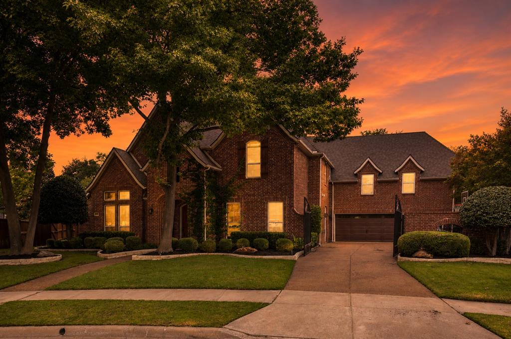 Nestled on a quiet cul-de-sac in the highly sought-after golf course community of Bridlewood, this beautifully designed home blends timeless elegance with the comfort and functionality families are truly looking for. Offering 5 bedrooms, 4.5 bathrooms, a 3-car garage, and thoughtfully curated living spaces throughout, the home is equally suited for everyday living and effortless entertaining. Located within award-winning Flower Mound schools, it’s the kind of home families can settle into and enjoy for years to come.

From the moment you step inside, the home feels warm and inviting with rich hardwood floors, soaring ceilings, and natural light throughout. A private study with custom built-ins provides the perfect work-from-home space, while the chef’s kitchen serves as the heart of the home with a large island, gas cooktop, double ovens, built-in refrigerator, breakfast bar, and butler’s pantry designed for both function and gathering. The spacious family room features vaulted beamed ceilings and a stunning fireplace, creating a welcoming space to relax or entertain.

The downstairs primary suite offers a peaceful retreat with its own sitting area and a spa-inspired bath complete with a jetted tub, separate shower, and beautiful natural light. Upstairs, generously sized secondary bedrooms are paired with an oversized game room that offers endless flexibility for movie nights, entertaining, or play.

Outside, the backyard was designed to be enjoyed year-round. A sparkling pool and spa, outdoor kitchen, covered patio, and expansive grassy areas create the perfect setting for everything from quiet evenings at home to hosting family and friends.