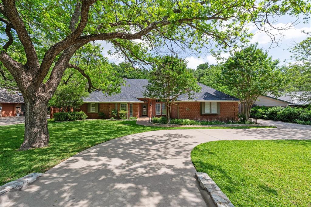 Welcome to this exceptional 3-bedroom, 3-bathroom, 2-car garage riverfront property in Pecan Plantation gated golfing community. This home boasts extensive, stylish updates and upgrades, offering a perfect blend of comfort and elegance. One of the most striking features of this home is the panoramic views of the Brazos River, visible from every room on the back of the house. Handsome engineered wood floors flow seamlessly throughout the living spaces. With 3  stunning fireplaces, warmth and ambiance are never in short supply. The family room and breakfast room are adjacent to the chef's dream kitchen, featuring sleek quartz countertops, abundant cabinetry, and a convenient wet bar and coffee bar. The separate office provides a quiet retreat, ideal for remote work or study. The primary bedroom is a true sanctuary, featuring a cozy sitting area and a beautifully appointed en-suite bathroom. The split-bedroom layout with a Jack-and-Jill bath provides privacy and convenience for family or guests. Step outside to discover a lovely terraced backyard adorned with towering trees and paths leading down to the riverfront. The attractive and sturdy backyard fence ensures privacy and security, while the river irrigation system for the sprinkler system keeps your outdoor oasis vibrant. Additional features include a whole house Generac generator with 250 gallon buried tank, a newer composition roof & gutters, providing peace of mind for years to come. Don’t miss the opportunity to make this remarkable property your own, where luxury meets nature in perfect harmony. Call and schedule your private showing today! So many amenities to enjoy here--2 golf courses, marina, campgrounds, 2 swimming pools, country club, dog park, tennis, stables and more! Top notch VFD & 24-7 EMS. Minutes from Lake Granbury and historic courthouse square with quaint shops, restaurants, art and cultural events, festivals, and weekend activities. An hour from Ft. Worth.