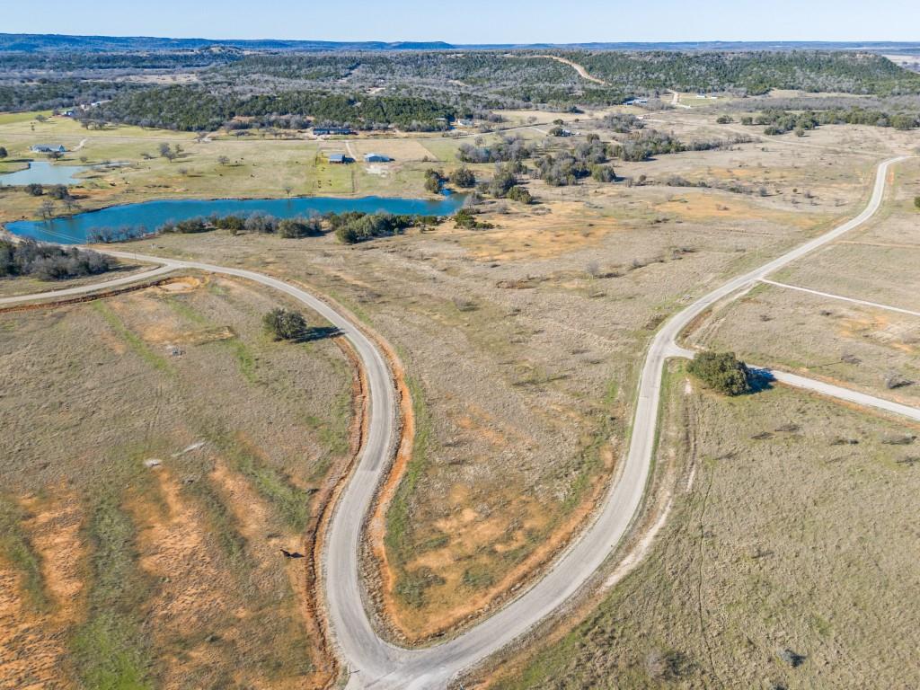 Stunning 7.5 Acre Property in Brazos Mountain Ranch – A Premier Gated Community. Escape the hustle and bustle of city life and experience tranquility on this beautiful 7.5-acre property located in the prestigious Brazos Mountain Ranch. Whether you're dreaming of building a cozy getaway cabin, a modern barndominium, or simply want a place to retreat and recharge, this property offers endless possibilities for you to create your perfect escape.
This serene parcel features breathtaking views of the surrounding landscape, perfect for stargazing under the vast Texas sky. Enjoy access to the neighborhood's private river access and a 5-acre park, providing the perfect setting for outdoor activities, relaxation, and nature walks. Located just 45 minutes from Possum Kingdom Lake and near Palo Pinto County's new State Park, you'll have access to a wealth of outdoor adventures, including hiking, camping, fishing, and horseback riding. The new State Park offers a visitor’s center, playscape, pavilion, and more, ensuring fun for the whole family. As part of the Brazos Mountain Ranch community, this property comes with mandatory membership in a cattle grazing association, ensuring that the AG-Exemption remains intact for all property owners. Don't miss out on this incredible opportunity to own a piece of Texas in one of the most sought-after gated communities. Make this property your own and start building your memories today! Please review the information in the Transaction Desk!