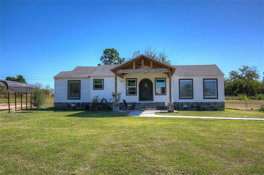 Exceptional Location for work, live and play! Outside City limits with no restrictions. A total remodel 3 years ago, this cute farmhouse with a large garage shop and a pond on 4.0 AC offers a unique opportunity. The perfect blend of residential style & commercial versatility, ideal for business owners, hobbyists, or anyone seeking space to live, work, and create. The remodeled home pairs modern style with practical design, while the detached 30x30 garage with full bath and oversized roll-up doors provides endless possibilities for work, storage, or recreation.
Be welcomed to the 3 bed 2 bath home by a charming shaded concrete front porch with flagstone steps and a unique rounded front door that adds character and curb appeal. Step inside the inviting living room, which is open to the kitchen and dining area. The open-concept kitchen is a true centerpiece, featuring granite countertops, a breakfast bar, and two undermount sinks—one on each side for ultimate convenience. Plus SS range and vent hood, pantry nook and custom tile backsplash. Spacious dining area has door to the back yard.
The split-bedroom layout ensures privacy. A spacious primary suite offering vintage hardwood floors, a walk-in closet, and a ensuite bath with fully tiled step-in shower with glass doors and a double-sink vanity. Two bedrooms on the other side of the house boast vintage hardwood floors and double windows. The hall bath also impresses with double sinks and a stylishly tiled walk-in shower.
Beyond the home, a 30x30 detached metal garage shop is a dream come true for car enthusiasts, RV or boat owners, or anyone needing serious workspace. It includes two high roll-up doors tall enough for large vehicles, lofted storage space, and even has a full bathroom inside! This could be a commercial space or a small retail business.
Pond is just steps from the house and has great fishing! 5 minutes to I-30, 90 min to DFW airport.