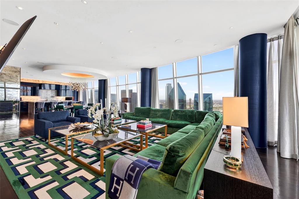 Luxury High-Rise Residence with Designer Renovation and Panoramic Views. Experience refined high-rise living in this 4,681-square-foot residence at Museum Tower, located on the 37th floor in the Dallas Arts District. This bespoke condominium offers three bedrooms, three full bathrooms, and one half bath, with a thoughtfully designed layout and elevated finishes throughout. The residence features a $2 million renovation by Susan Newell with interiors curated by Allen Kirsch. The open-concept living and dining areas include a marble-clad fireplace and seamless flow for entertaining. The gourmet kitchen is equipped with high-gloss cabinetry, Miele appliances, and a marble waterfall island. The primary suite has been reimagined to include a private dressing room, expansive custom walk-in closet, and fireplace, creating a well-appointed retreat. Each secondary bedroom includes its own ensuite bathroom. Two outdoor balconies provide north, west, and south-facing views of Downtown Dallas, Klyde Warren Park, and Uptown. Additional features include four reserved parking spaces on Level 1, ideal for self parking, two storage units, and access to valet services. Residents enjoy a full-service lifestyle with amenities that include 24-7 concierge, fitness center, pool, clubhouse, electric vehicle charging stations, gated access, and maintained grounds. HOA coverage includes utilities and comprehensive maintenance services. A fully furnished offering is available, including a curated furniture collection.