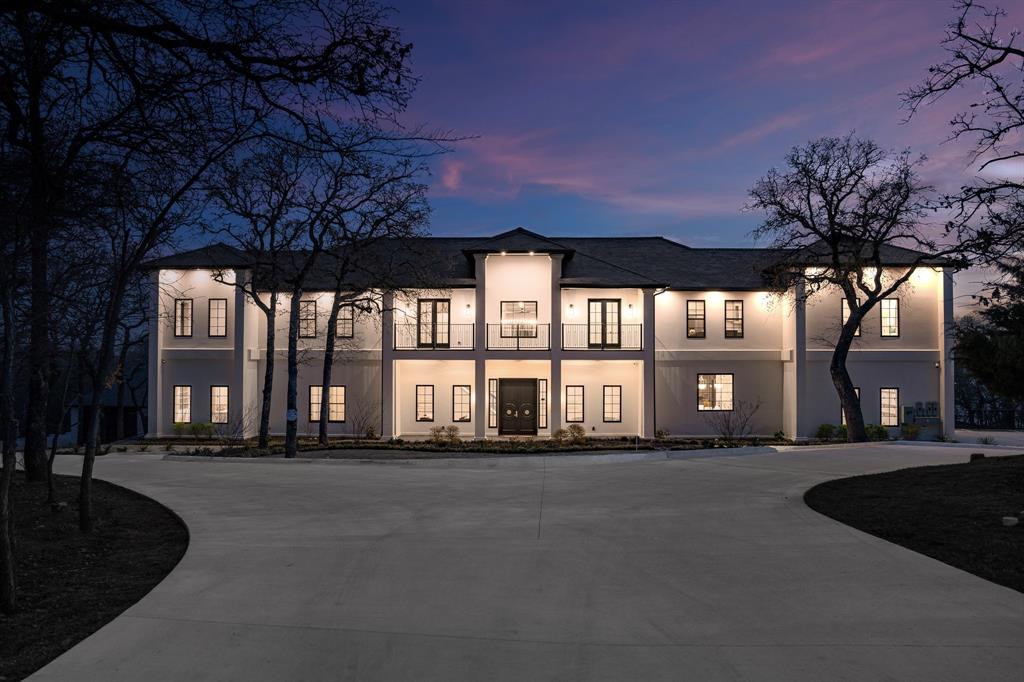 Newly completed in February 2025, this exceptional estate, MULTIGENERATIONAL home, is situated on a private 1.33-acre cul-de-sac lot with direct access to Lake Lewisville and 4 acres of adjacent Corps of Engineers property for ultimate privacy.
The home boasts superior ICF (Insulated Concrete Forms) construction, utilizing 2 million pounds of cement and 168 piers. The interior features six spacious bedrooms, six full baths, and two half baths, making it ideal for a variety of living arrangements. The gourmet kitchen is appointed with Bentwood cabinetry, quartzite countertops and backsplashes, and high-end appliances. Pella custom windows and French doors are featured throughout, offering stunning lake views from every room. Additional highlights include a Sky Deck with panoramic views of Lake Lewisville, a full second kitchen upstairs perfect for multi-generational living, and a commercial-grade elevator. The full basement provides versatile design opportunities for a media room or bowling alley. Located near the Willow Bend Polo Club and Dallas Corinthian Yacht Club, this property on Oak View Ct presents a rare opportunity for luxurious lakeside living.