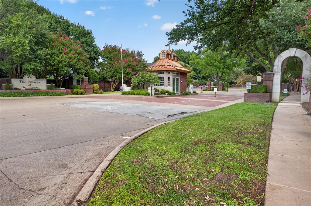 Nestled beneath mature shade trees in the prestigious gated community of Stonegate, this beautifully updated custom home offers timeless architecture, sophisticated finishes, and exceptional indoor-outdoor living in the highly sought-after Tanglewood Elementary attendance area. Built in 1993 and thoughtfully renovated, this 3-bedroom, 3.5-bath residence spans 2,712 square feet on a beautifully landscaped .223-acre lot.

A dramatic two-story foyer welcomes you inside where soaring ceilings, rich adobe tile floors, designer lighting, plantation shutters, and fresh contemporary finishes create an elegant yet inviting atmosphere. The spacious living areas flow seamlessly into the updated chef's kitchen featuring abundant cabinetry, granite countertops, stainless appliances, a center island, and generous prep space—ideal for everyday living and entertaining.

The luxurious primary suite is a true retreat with a completely remodeled spa-inspired bath showcasing a freestanding soaking tub, oversized walk-in shower, dual vanities, and designer finishes.

Step outside to your private backyard oasis featuring a sparkling pool and spa, expansive stone patio, outdoor kitchen, covered pavilion, fire pit, and mature landscaping that offers both beauty and privacy.

Ideally located just minutes from upscale shopping, fine dining, and Chisholm Trail Parkway, this move-in ready luxury home combines comfort, style, and convenience in one of Fort Worth's most desirable gated neighborhoods.