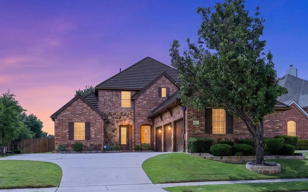 Welcome home to this stunning east-facing five-bedroom home proudly situated on a large corner lot in the highly sought-after community of Lantana. From the moment you step through the front door, soaring ceilings, elegant crown molding, and extensive wood flooring welcome you into a bright, open-concept floor plan designed for effortless modern living. Bask in the warm glow of natural light streaming through the plantation shutters, or gather with loved ones around the gas log fireplace in the cozy family room. The heart of the home is a chef-inspired kitchen boasting rich granite countertops, stainless steel appliances including a premium Bosch dishwasher, a farmhouse sink, a central island with a breakfast bar, and a seamless butler's pantry that connects directly to the formal dining room for ultimate entertaining ease. The versatile second living area downstairs features a beautiful wall of built-ins and serves as the perfect open flex space or home office. Retreat to the secluded primary suite complete with a relaxing sitting area, custom closet system, dual-sink extended vanity, jetted tub, and a sleek frameless shower. Guests or family will love the privacy of the secondary bedroom and full bathroom located downstairs. Upstairs, the entertainment options soar with a huge game room and an adjacent private media room featuring dimmable lighting, perfect for movie nights. Step outside to your spacious backyard where a spectacular outdoor living area awaits under a charming pergola, complete with a built-in grill, a dedicated space for your smoker, and refreshing ceiling fans to keep you cool. Other upgrades include a Class IV metal roof and a recently replaced fence with durable wrapped metal posts. Complete with a three-car garage boasting insulated doors and access to premier Lantana amenities like community pools, fitness centers, and tennis courts, this home truly captures the essence of Texas luxury living.  Click the Virtual Tour link to see the 3D Tour!