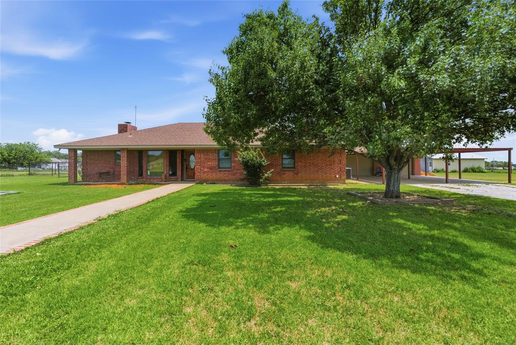 Tucked beneath wide Texas skies just minutes from downtown Graham, this charming 5-acre ranchette offers the kind of peaceful country living buyers dream about. The 3-bedroom home is filled with warmth and character, featuring inviting covered porches, scenic views, and spaces designed for gathering with family and friends. A flexible den could easily serve as a 4th bedroom, office, or game room. The separate guest quarters create endless possibilities for visitors, multigenerational living, or a private retreat. Outside, fenced acreage provides room for horses, kids to roam, gardening, or simply enjoying the quiet seclusion of your own private paradise. A covered RV-boat garage, dry storage area, and ample outdoor space add function to the charm. Whether you envision mornings on the porch with coffee, evenings under the stars, or a slower-paced lifestyle with room to breathe, this property captures the heart of Texas country living.