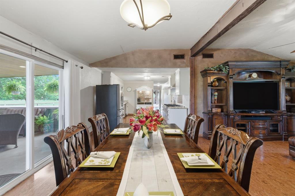 Experience peaceful country living on nearly 5 pristine, fully fenced acres in Poolville. This is not a mobile or manufactured home. It is a quality-built, permanent, site-built residence featuring a combination slab and pier-and-beam foundation.

Natural light fills the thoughtfully designed floor plan with beautiful pasture views throughout. The home may also be sold furnished, making your move even easier.

The kitchen features granite countertops, custom built-ins, and a commercial-grade Forno 8-burner, double-oven gas range that opens to the spacious dining area. The living room offers soaring 10-foot ceilings and a floor-to-ceiling stone fireplace with one-touch ignition. Laminate flooring extends throughout the home, with carpet in the bedrooms. Central heat and air provide year-round comfort.

The oversized primary suite includes a large walk-in closet, sitting area with French doors to a private deck, and an ensuite bath with dual vanities, a garden tub, and separate shower.

The insulated 20x25 shop is equipped with 14-foot ceilings, a 10-foot roll-up door, mini-split HVAC, 220-volt power, and built-in shelving.

Additional improvements include a private grandfathered well, two approximately two-year-old 500-gallon septic tanks, an owned 500-gallon propane tank, blown attic insulation, and new rain gutters.

Enjoy the 25x25 covered patio with an outdoor kitchen, refrigerator, smoker, and grill. Mature pecan trees, Coastal Bermuda grass for hay production, and open acreage provide space for livestock, gardening, or recreation. Two Angus cattle may convey with an acceptable offer, and additional adjoining acreage is available for purchase. A front-entry two-car garage completes this exceptional country property.