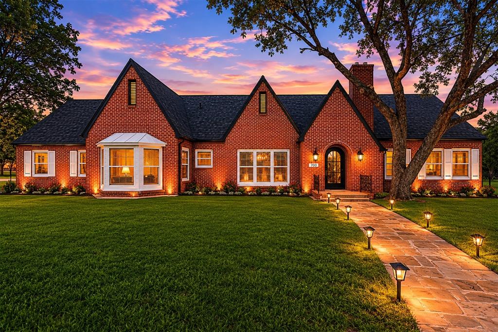Welcome to this beautifully remodeled brick corner-lot home offering 3 bedrooms, 2 bathrooms, and 2,812 sqft of thoughtfully updated living space. From the moment you arrive, you’ll notice the charming stone sidewalk leading to the front entrance along with a brand-new roof and impressive curb appeal. Step inside to an open floorplan featuring laminate flooring and recessed lighting throughout. The spacious living room offers built-ins, an electric fireplace, plus an additional wood-burning fireplace for extra warmth and character. The dining area is filled with natural light from the many surrounding windows, creating the perfect gathering space. The kitchen is designed to impress with a large island and barstool seating, quartz countertops with a matching backsplash, all-new cabinetry, stainless steel appliances that will convey with the sale, and a gas stove range. Just off the kitchen is a sunny breakfast nook area perfect for morning coffee.
The oversized primary suite features built-in shelving, an electric fireplace, and a spacious walk-in closet. The primary bathroom includes a walk-in marble tile shower, tile flooring, quartz countertops, and ample cabinet storage. One secondary bedroom features beautiful bay windows for extra sunlight, while another showcases a stylish blue accent wall. The guest bathroom offers another walk-in marble shower, quartz countertops, and a modern LED touchscreen mirror.

As an added bonus, the home includes a game room or flex space perfect for entertaining, a home office, or additional living space. Step outside to enjoy the courtyard area, large fenced backyard, spacious rear-entry driveway leading to a two-car garage, and a generously sized storage shed.