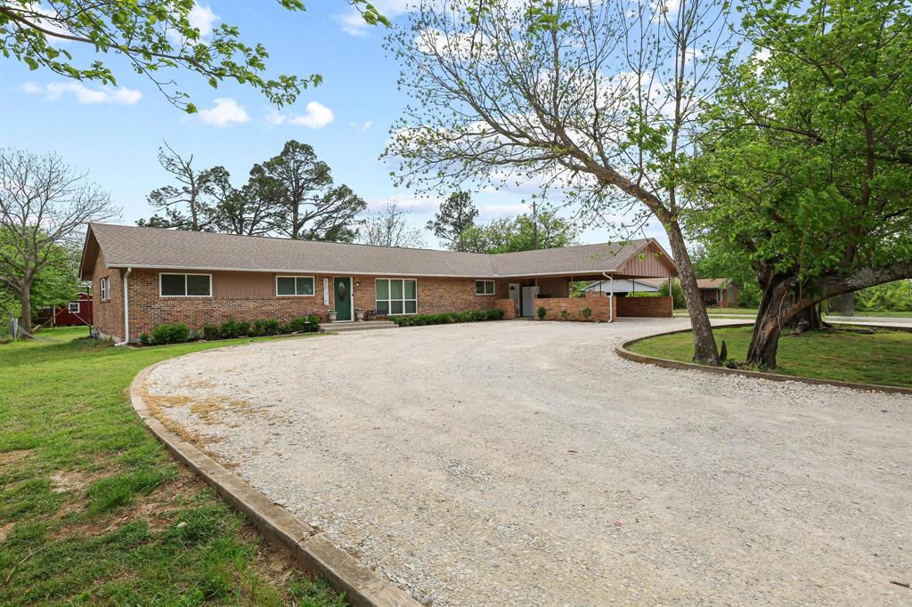 Welcome to 416 4th Street in beautiful and family friendly Whitesboro. A place to grow a garden, children can play and walk to school, raise chickens and have some breathing room. This well-kept brick home offers over 2000sqft of living, 4 bedrooms, 2 baths, spacious kitchen, lots of storage and a versatile bonus room space that could be converted so many ways! Sitting on .7acres, this amazing lot has a large circle driveway, oversized carport with storage, ample parking, mature trees and a fantastic private backyard. Enjoy the large patio space to grill out or roast marshmallows on the firepit. There is a chicken coop, raised garden beds and two new storage sheds, 10x15 and 10x16, with electricity. A long list of upgrades include New Windows, LVP Flooring, Granite Kitchen Counters, New Kitchen Sink, Fresh Paint, Exterior Doors, Gutters, Plumbing, all new HVAC, Water Heater, additional Insulation in Attic & Crawlspace and MORE! This property is move-in ready. Schedule your showing today!