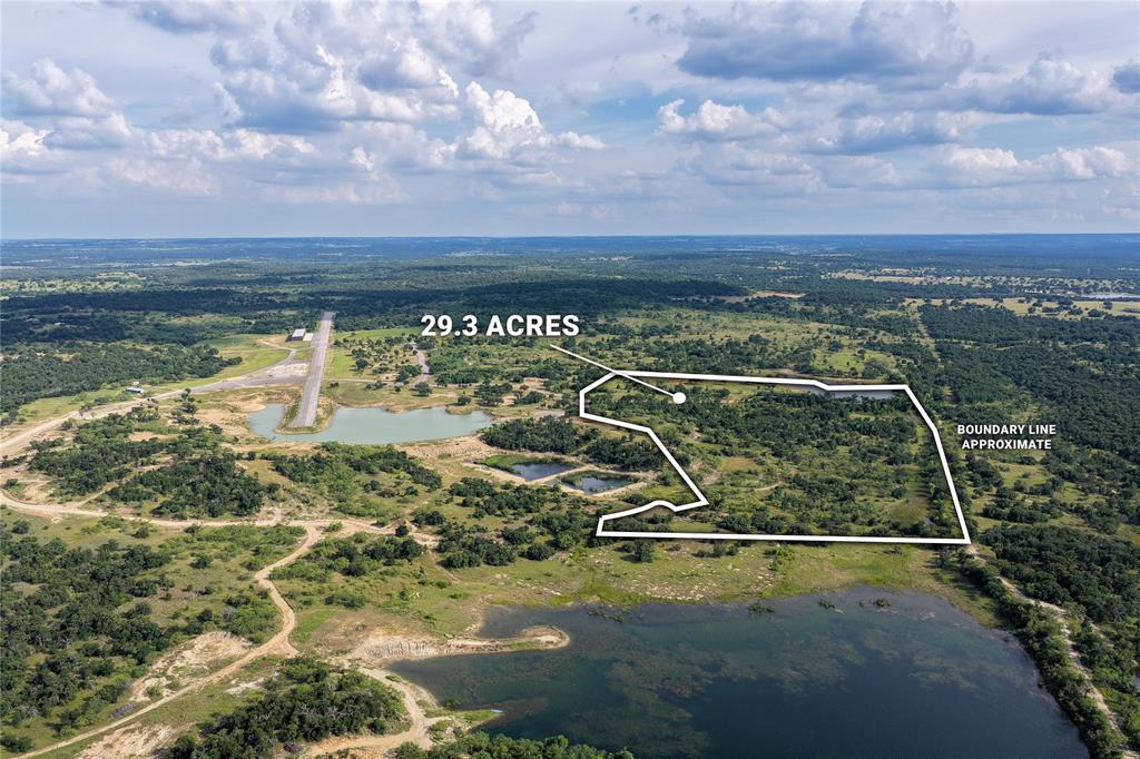 Experience the ultimate blend of waterfront ranch living and aviation lifestyle on this exceptional 29.3-acre tract located within Yellowstone near Santo, Texas. This beautiful property features frontage on a private lake, offering stunning water views, abundant wildlife, and endless opportunities for fishing, kayaking, paddle-boating and outdoor recreation. The property provides multiple ideal homesites with ample room for a custom home, barn, shop, guest house and horses. Gently rolling terrain, native grasses, and scattered trees create a picturesque setting while still offering privacy. A unique feature of Yellowstone Development is access to the community's paved and lighted private airstrip, allowing aviation enthusiasts the convenience of flying directly into the development. Use of the airstrip is subject to applicable rules and guidelines. Hangars are also available for purchase within the development providing opportunities for aircraft storage and aviation focused living.