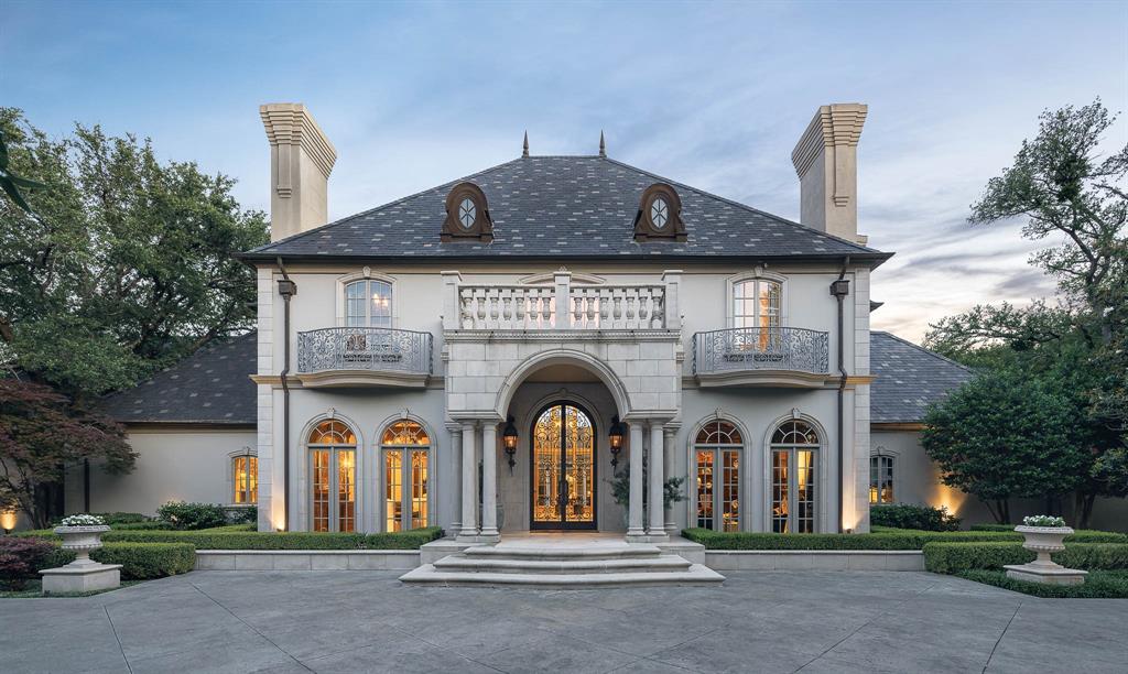 Presenting a stunning French estate by Sharif & Munir on a gated 1.12-acre lot in Preston Hollow. This 9,900 sq ft mansion, accompanied by an 851 sq ft guest quarters, showcases elegant design with intricate flooring, exquisite woodwork, and eight fireplaces. A magnificent two-story foyer leads to spacious living areas perfect for grand entertaining, offering breathtaking views. The main level boasts a luxurious primary suite featuring a private courtyard, adorned with Beaux Arts millwork and a lavish black Petero marble bathroom. The gourmet kitchen, a chef’s dream, is complemented by a 1,600-bottle wine room. Enjoy views from the 390 sq ft loggia overlooking the backyard oasis with a sparkling pool, inviting spa, and meticulously manicured gardens, creating a serene outdoor retreat within the city. Additional amenities include geothermal heating, a generator, and a four-car garage, ensuring comfort and convenience in this unparalleled estate. Experience luxury living at its finest.