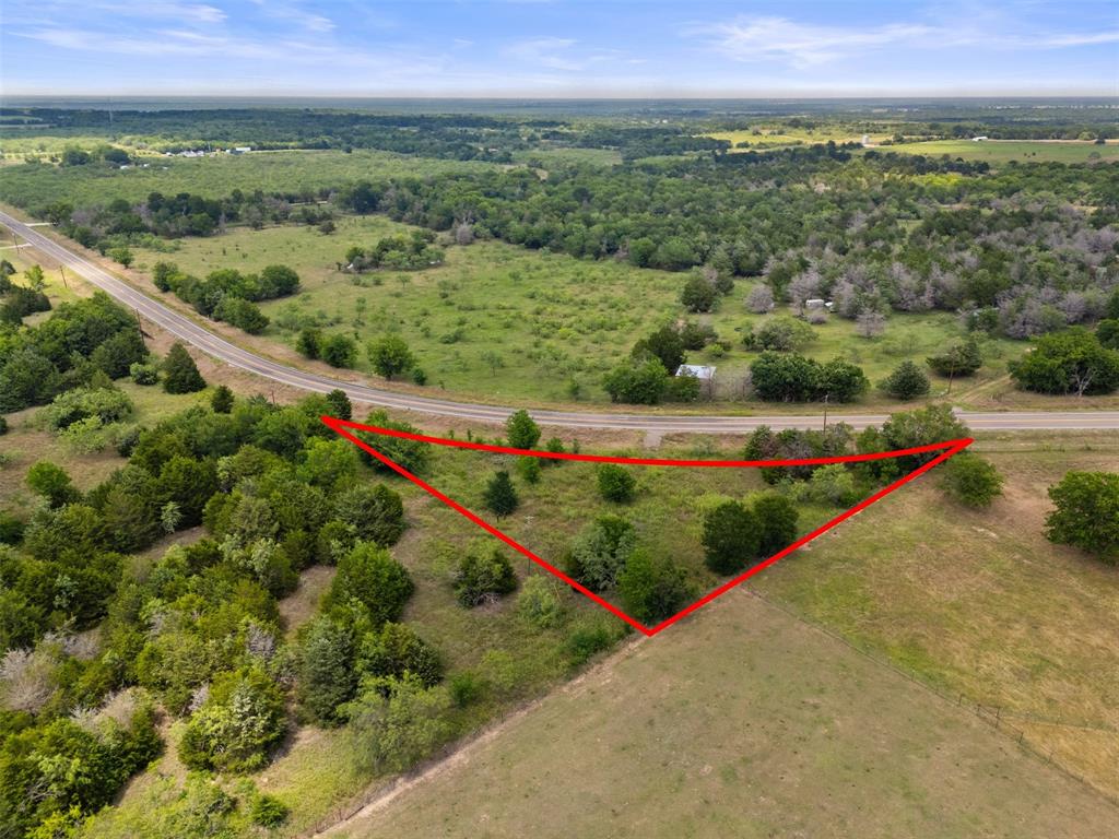 Explore an outstanding opportunity with this 1.06-acre property in Kerens, Texas, ideal for your new home. This land is fully equipped with water, electricity, and a septic system from a previous residence, making it ready for your new construction or tiny home. Situated in a peaceful county setting, the lot boasts mature trees, fencing, and a culvert for easy access. Relish the tranquil surroundings while enjoying convenient access via well-maintained roads, all within an hour's drive from the Dallas-Fort Worth area. Buyers are advised to verify the availability and use of utilities.