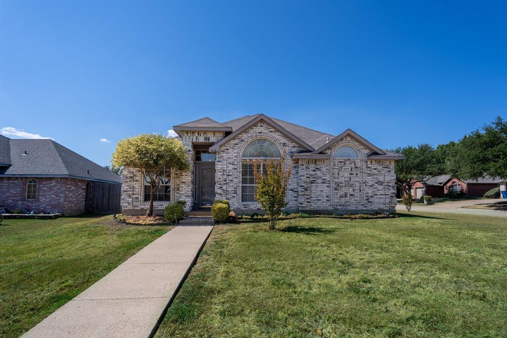 Welcome to Windmill Ridge Estates one of the most convenient subdivisions in Rockwall, TX! This 3 bedroom 2 bath home set on a corner lot features a large covered back porch. Immediately when you walk through the front door, the stained concrete floors stand out and make for easy cleaning. The dining room and kitchen are all connected with the breakfast area which makes for entertaining and dining easily accessible. The living room features a brick wood burning fireplace with plenty of room for your furniture. The primary bedroom is large and has an en suite bathroom with separate shower and closet space. The secondary bedrooms each have ceiling fans and are good sized to fit a queen bed. The corner lot makes for a lot of yard space. The backyard has a covered deck with a spa for relaxing and enjoying the Texas sunsets. Don't miss this gem that is affordably priced in Rockwall! Rockwall ISD is a great school district!