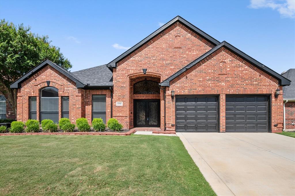 IT ONLY LOOKS EXPENSIVE....this gorgeous 3 bedroom home offers space, style and a beautiful design.  The impressive foyer with massive glass and iron doors lead to the home you will with ceramic tile flooring throughout and chandeliers.  Open style concept lifestyle you didn't know was possible in this price range.  Home features a secluded primary bedroom with onsuite bath, which features a jetted tub, separate shower, dual sinks and a walk - in closet with a chandelier!  Gourmet kitchen with gas cooking has many upgrades including a work island and built-in refrigerator-freezer.  Eat in breakfast nook PLUS a formal dining room.  Home also offers 2nd  liiving area that could be utilized as a home office or playroom.  Bonus for the Buyers:  Wrap around sunroom is enormous and has it's own heat and air unit and a woodburning fireplace.  When you step into the garage, you cannot miss the storm shelter the Sellers decided to include with the home.