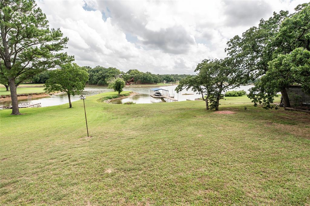 Lakefront Living on Lake Nocona!
Escape to this spacious 4-bedroom, 1-bath lake house nestled on over an acre of prime waterfront property on Lake Nocona. With plenty of room to spread out, this property offers a large yard perfect for outdoor fun, gatherings, and making lasting memories. The open-concept floor plan creates a welcoming space for entertaining family and friends, while the covered dock provides easy lake access for boating, fishing, and relaxing by the water. The windows provide a great view of the lake from the game room inside the home! Located on one of North Texas’ premier fishing and recreational lakes, this is the perfect getaway or full-time retreat for those seeking peaceful lake life with endless opportunities for adventure.