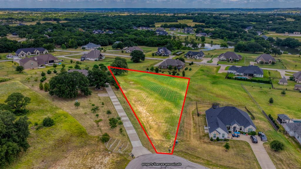 It's time to bring your building plans to life! Don't miss this incredible opportunity to own a fully cleared and platted cul-de-sac lot on the Fort Worth side of Granbury. Spanning approximately 1.403 acres (61,114.7 square feet), this build ready homesite offers the perfect setting to design and build your dream home. Located in the highly sought after Rolling Creek Ranch gated acreage community, you'll enjoy peaceful Texas living where wide open views, custom homes, and tranquil surroundings come together. Ideally situated just 30 minutes from Fort Worth and just minutes from Granbury's fantastic parks, bike paths, walking trails, shopping, dining, live entertainment, and the rich history that makes Granbury one of Texas’ most treasured towns. Granbury has officially been named the #1 Best Historic Small Town in America for the 5th time by USA Today. Exceptional amenities including ponds, a community covered pavilion and park, and sports fields featuring a pickleball court, basketball court. Imagine designing a home that's uniquely yours, surrounded by peaceful Texas scenery and custom homes. This spacious, fully cleared homesite is ready for your plans and vision. Come experience why life in Granbury is so easy to love. Don't let this incredible opportunity pass you by. Your future home awaits!