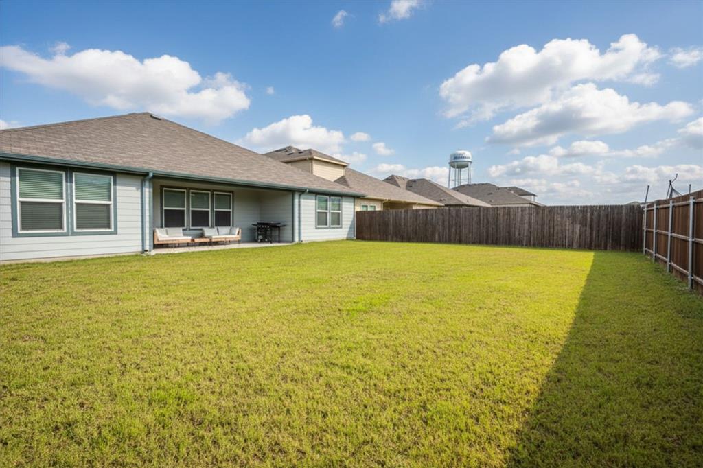 Welcome home to this stunning 2023-built DR Horton gem nestled in The Parks of Alvarado, just minutes from Alvarado ISD schools! This spacious 4-bedroom, 2-bath home offers 2,172 square feet of thoughtfully designed living space with an open floorplan perfect for everyday living and entertaining.

Step inside to beautiful wood-look tile flooring that flows throughout the main living areas, with cozy carpet in all bedrooms. The heart of the home is a gorgeous kitchen featuring a large island breakfast bar, tile backsplash, and a walk-in pantry — open to both the living room and breakfast nook for seamless connection.

The dedicated dining room adds versatility for family gatherings. The spacious primary suite is a true retreat, offering a luxurious ensuite bath with separate shower, garden tub, double sinks, and a generous walk-in closet with extra storage shelving — plus plenty of room for a sitting area.

Three additional bedrooms provide space for family, guests, or a home office. The 2-car garage adds convenience and extra storage. Out back, enjoy a covered patio and a good-sized fenced yard — ideal for pets, play, and relaxing evenings.

This well-maintained, like-new home is move-in ready and priced at $359,000. Come see everything this beautiful community has to offer!