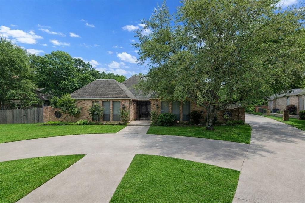Timeless French Country architecture meets resort-style living in this exceptional home perfectly situated on a spacious .50-acre cul-de-sac lot that feels private and secluded while still being conveniently located in the heart of Paris.

A charming gated courtyard entry creates a welcoming first impression and leads into a gracious foyer featuring elegant parquet flooring, setting the tone for the character and craftsmanship found throughout the home. Chandeliers throughout add warmth and sophistication while complementing the home’s classic architectural style.

This thoughtfully designed 4-bedroom, 4.5-bath residence offers generous living spaces ideal for both everyday living and entertaining. The grand living room features custom built-ins and a beautiful fireplace, creating a warm and inviting gathering space. Just beyond, a light-filled sunroom overlooks the backyard oasis, where a sparkling saltwater pool provides the perfect place to relax and unwind.

The chef’s kitchen is equipped with a gas cooktop, double ovens, granite countertops, abundant custom cabinetry, and a versatile flex space with water connections ideal for a wine bar, coffee station, or additional prep area.

The primary suite offers a private retreat with dual primary bathrooms and expansive walk-in closets with custom built-ins. Guest bedrooms are arranged in a split layout, with two bedrooms offering ensuite baths, providing comfort and privacy for family or guests.

Additional highlights include a formal dining room, charming breakfast room overlooking the pool, circular drive, oversized garage, and additional parking. The backyard also offers a grassy yard area perfect for pets or play.

This one-of-a-kind property blends timeless style, space, and comfort in a truly special setting.