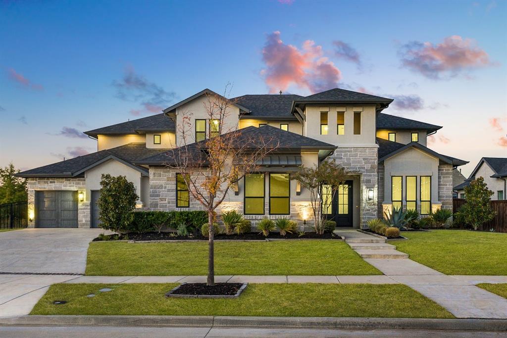 Sophisticated design and exceptional versatility define this stunning Edgestone residence. A grand double-door foyer with tall ceilings, wood floors, and a statement chandelier sets the tone. The private study features ceiling beams, French doors, and floor-to-ceiling built-ins. A rare main-level flex suite, ideal for a game room, gym, or secondary living offers a wet bar, en-suite bath, and private backyard access. The open-concept dining room includes a built-in serving bar with upper cabinetry and designer tile. A chef’s kitchen impresses with fabulous pendant lighting, breakfast bar island, commercial-grade gas cooktop, double ovens, farmhouse sink, and illuminated display cabinetry. A generous butler’s pantry with sliding door and abundant storage connects seamlessly. The naturally bright living room features wood floors, ceiling beams, a gas fireplace flanked by built-ins, and sliding patio doors. Primary suite highlights include beam accents, large windows, and a luxurious bath with dual vanities, a soaking tub, expansive walk-in shower, and an incredible custom closet with chandeliers. A well-appointed utility room offers garage and primary-closet access. Two oversized 2-car garages, mud area with built-ins, and a full security system add convenience. Upstairs includes a spacious game room, media room, hall storage, and three additional bedrooms, each with generous closets and en-suite or adjacent baths. The resort-style backyard is made for entertaining with a large covered patio, remote screen, pool and spa with water feature, fire pit, manicured landscaping, grassy play space, and serene and spacious greenbelt views through the wrought iron fence. Located in Frisco’s coveted Edgestone community, residents enjoy trails, parks, pools, fitness amenities, and close proximity to premier schools, shopping, dining, and DNT and 121.