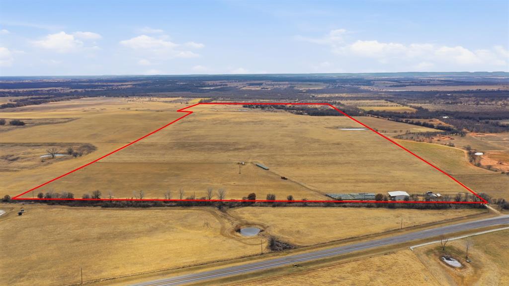 Nearly 147 acres in a prime De Leon location—just minutes from town—offering the rare combination of everyday convenience and wide-open space. Approximately 23 acres of native cover provide an ideal recreational or hunting area, while the balance of the acreage is set up for productivity with coastal fields suited for hay, grazing, and equine or cattle use.
The property is well laid out with cross-fencing for easy pasture rotation and multiple uses, plus beautiful views and several appealing homesites. Improvements include a 1,600 sq ft fully insulated building with plumbing already in place—perfect for a shop or barn, with the potential to finish out as living space. A large side overhang adds excellent covered storage for equipment or hay. Additional features include an extra storage shed and several pens ready for livestock.
Water is a standout with two wells supporting the property and feeding the tanks, providing reliable resources for both livestock and recreation. 
Good fencing, fantastic location, paved road access, improvements in place, multi purpose use!!  If you’ve been looking for a versatile, income-producing tract close to town with solid improvements already in place, this one is a must-see.  Speak to the agent about items that can keep with the property.