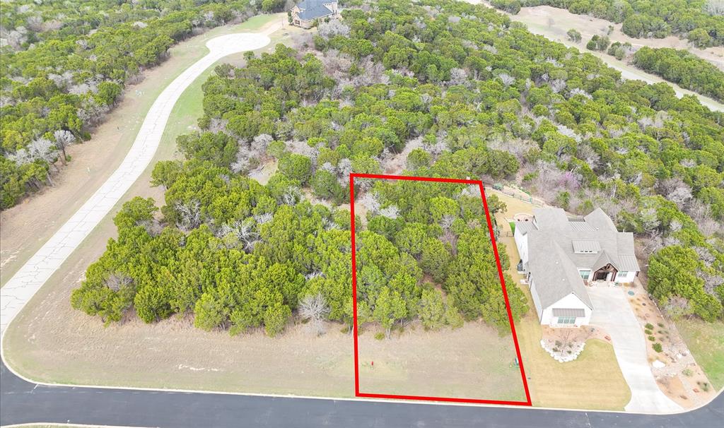 Build your dream home in The Retreat, one of North Texas’s premier private golf resort communities, located just 30 minutes south of Fort Worth. This beautiful 0.33-acre homesite offers excellent elevation and scenic valley views, providing the perfect setting for a custom residence, vacation retreat, or full-time home surrounded by nature.
Situated inside the 3,000-acre gated community of The Retreat in Cleburne, Texas, this property offers access to a championship 18-hole golf course, rolling hills, mature live oaks, and breathtaking Texas landscapes. Residents enjoy resort-style amenities including a full-service clubhouse with dining and pro shop, two community pools, walking and biking trails, a fitness center, and parks throughout the neighborhood.
Spend mornings on the golf course, afternoons relaxing at Live Oak Park, and evenings dining with friends while overlooking scenic fairways. With no required timeline to build, you have the flexibility to design and construct your custom home when the time is right while still enjoying the community amenities today.
If you’re looking for gated community living, golf course amenities, and peaceful hill country-style scenery just outside Fort Worth, this homesite offers an exceptional opportunity to create the lifestyle you’ve been looking for in The Retreat at Cleburne.