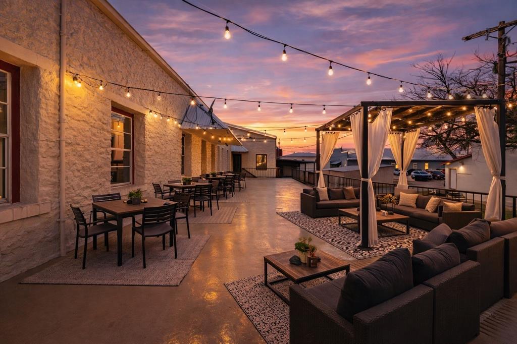 Don't miss out on this remarkable chance to own a slice of historic downtown Dublin, Texas! The Bob Evans Hotel beckons with approximately 16,940 sqft. This includes around 8,499 square feet on the ground floor, & 8,441 square feet on the upper level. Upstairs, discover approximately 4,293 sqft of finished living space, with a large workshop & ample room for additional residential or commercial space. The finished living area has five bedrooms & three bathrooms. Boasting ample indoor & outdoor gathering spaces, it is ideal for entertaining. The open-concept layout showcases a spacious kitchen with custom cabinets, granite countertops, & a large island with more storage. Downstairs showcases a versatile 4,148 square feet comprised of an occupied residential rental & endless commercial potential with multiple existing entrances on Blackjack that could be combined, or kept as separate units.  The size & location of the building offer endless investment strategies within one building and is in a designated opportunity zone.