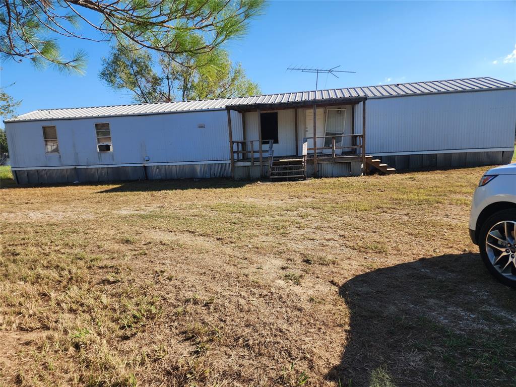 INVESTORS here is your next flip or rental. This 3 bedroom two bath mobile home needs some work but appears to be very stable and wouldnt take alot to get it where you want it to be. Nice size yard with a couple of buildings out back for storage and a fenced in back yard. Also has a circular driveway for an easy in and out. This property is close to Hwy 175 and downtown Mabank where you have several restaurants, the popular food truck yard and shopping places plus salons. Come on and get it. Selling AS-IS.