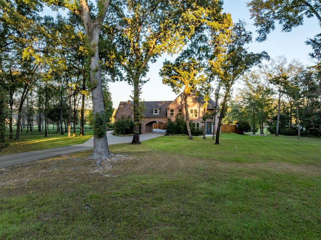 Lake Athens living reaches a new level at 2001 Rose Pointe, a beautifully renovated waterfront estate tucked inside an exclusive gated community on more than 2.7 private acres. Blending upscale comfort with the relaxed charm of the East Texas countryside, this exceptional property offers resort-style amenities, panoramic lake views, and thoughtfully designed spaces for both entertaining and everyday living.

Renovated in 2022, the home features an open-concept kitchen, dining, and living area centered around a warm gas-log fireplace. Multiple secondary living spaces and a spacious dedicated office provide flexibility for gatherings, work, or recreation. The luxurious primary suite overlooks the lake and opens onto a newly added covered balcony, creating the perfect retreat for sunrise coffee or evening sunsets over the water.

Outdoor living is equally impressive. A screened porch with its own fireplace flows seamlessly into an entertainer’s backyard featuring a heated gunite saltwater pool and spa surrounded by travertine coping, cool decking, and natural flagstone accents. A cedar pergola with a built-in grill, custom cabinetry, and nearby firepit creates an ideal setting for hosting family and friends year-round.

For boating and outdoor enthusiasts, the property includes a private boathouse with two slips offering direct access to the open waters of Lake Athens. A stone walkway leads from the home to the waterfront, while additional upgrades such as an engineered drainage system, lake-pump irrigation, irrigated flower gardens with stone retaining walls, and a whole-home generator add convenience and peace of mind.

A standout feature is the finished 35x35 climate-controlled workshop with loft space, perfect for hobbies, storage, recreational vehicles, or additional parking.

This extraordinary lakefront retreat offers the rare combination of privacy, luxury, recreation, and convenience.