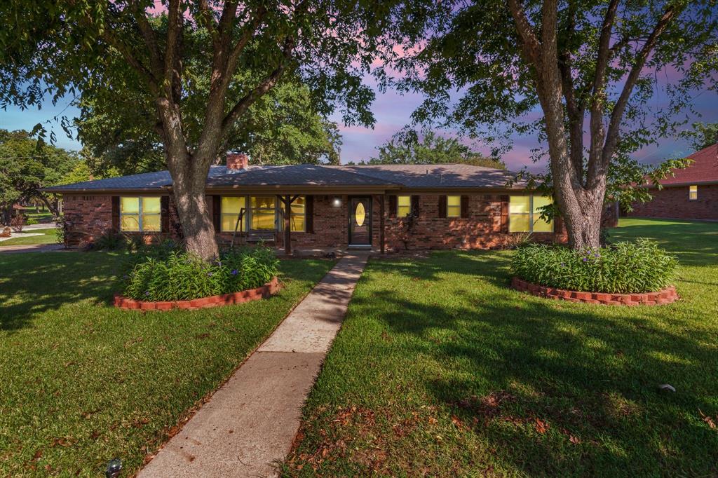 **Seller is offering a $5,000 buyer incentive towards HOA fees or closing costs.  Bring all offers**.  Recent updates: Roof replacement, Fireplace, Plumbing, HVAC & Electrical all in 2026.  Want to live in a well-established gated community with private golf course? Here is your chance. This well-maintained home does not come available in the De Cardova subdivision often. The drive through the guarded gate gives you the feeling of security for the family. This home is located well into the community & is located on the corner of Cortez Dr & Choctaw Dr. The lush established trees on the property give lots of shade to help keep the home cool in the hot days of summer. The front porch is inviting & leads you into this home. As you walk into the front entry you will notice tile flooring flows throughout the home making it easy to care for with kids & pets. Living area, one is as you enter the home with a fireplace & natural light flowing in from the windows. The kitchen & dining area are combined making it easy to serve family & friends. The kitchen has granite counter tops, electric cooktop, electric oven, pantry & stainless sink. The laundry room has cabinets for storage, room for full size washer & dryer. The extra room off the kitchen can be used in so many ways, i.e., butler pantry, storage, office, animal area, play area for kids. The primary bedroom & bath, secondary bedrooms & bath will delight family & friends. The second living area is off the kitchen that could be used in many ways, i.e., play area for kids or tv area. Walking outside to the backyard you will notice the well-built fence around the perimeter of the backyard, a pergola, dining area, large storage workshop with electricity, fenced dog-run, blank slab area that is wired for a hot tub or for anything you want. The location of this home puts it in demand due to easy access of major highways, Granbury Lake, schools, restaurant’s, entertaining & shopping. Come see for yourself!