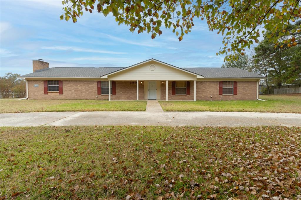 Welcome to this spacious 4-bedroom, 3-bath home offering comfort, versatility, and room to grow in a peaceful country setting just minutes from town. With both a welcoming living room and a separate game room, there’s plenty of space for relaxing, entertaining, and everyday living. Two fireplaces add warmth and character, creating cozy gathering spots for family and friends. The kitchen and dining combo provides an open, functional layout with great potential for updates to match your personal style. All bedrooms are generously sized, offering comfortable retreats and ample closet space. You’ll appreciate the abundant storage throughout the home, making organization easy. An oversized laundry room with utility sink adds extra convenience with room for additional storage and folding space. Step outside to enjoy the large covered back porch—perfect for morning coffee, evening sunsets, or outdoor entertaining year-round. This property offers the best of both worlds: quiet country living with quick access to town amenities. With a little TLC, this home has incredible potential to be truly special. Whether you’re looking for a family home, investment opportunity, or a place to make your own, this one is full of promise.