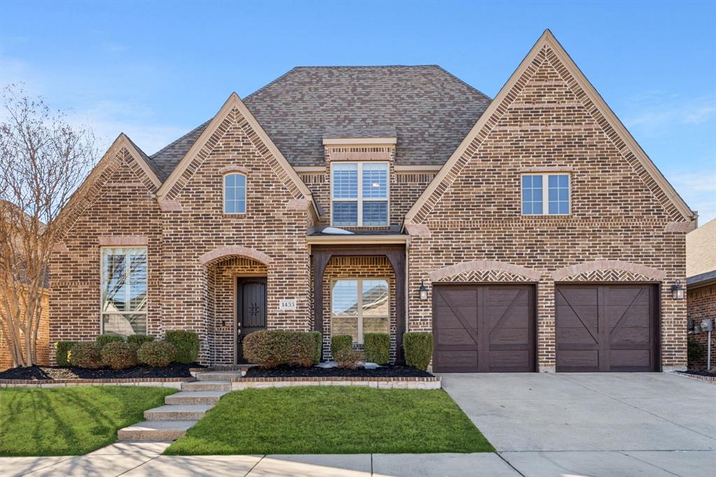 Welcome home to this stunning Highland-built, two-story brick beauty in the highly sought-after Harvest community of Argyle, TX. From the inviting front porch and front-entry 3-car tandem garage to the elegant foyer with decorative lighting and rich hardwood floors, this home is packed with thoughtful details. The open-concept living area features a vaulted ceiling, stone fireplace, ceiling fan, built-in desk, and beautiful views of the backyard, creating a warm and welcoming space for everyday living and entertaining. The private front office showcases built-in shelving and French doors, perfect for working from home. The chef’s kitchen is a showstopper with a gas cooktop, double ovens, farmhouse sink, quartz countertops, white cabinetry with select glass-front cabinets, a large island, and a built-in wine refrigerator. The breakfast nook offers easy access to the backyard, ideal for indoor-outdoor living. The spacious primary suite is located downstairs and includes a cozy sitting area, soaking tub, separate shower, and an oversized walk-in closet. A secondary bedroom with a walk-in closet is also conveniently located on the main level. Upstairs, enjoy a large loft or family room, media room, a bedroom with ensuite bath and walk-in closet, plus two additional bedrooms—all with walk-in closets. The backyard features a wood fence, covered patio, and plenty of space for a future pool and play area. Residents of Harvest enjoy incredible amenities including multiple community pools, playgrounds, clubhouse, fitness center, jogging paths, community garden, and the charming Coffee Farmhouse. This home truly offers the perfect blend of comfort, style, and community living.