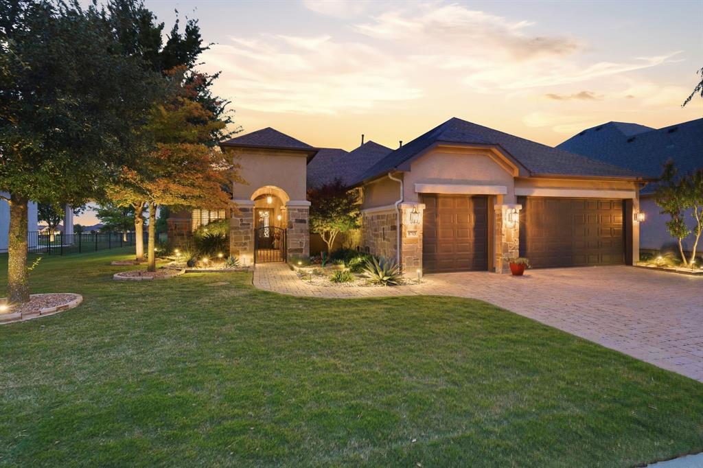 Welcome to this stunning Navarro model ideally situated on Hole #2 of the North Course, offering breathtaking golf course views of the lush green while enjoying the advantage of a desirable no-ball zone and not facing the west sun —allowing you to relax and entertain without worrying about stray golf balls in your yard. This beautifully appointed home showcases numerous upgrades throughout and features a thoughtfully designed floor plan perfect for both everyday living and entertaining. The formal dining room provides an elegant space for gatherings, while the versatile flex room can easily serve as a home office, media room with surround sound and projector with large screen, or additional living area. The thoughtfully designed primary suite includes a convenient pass-through from the primary bathroom to the utility room, creating a seamless flow for daily living. This exceptional home is loaded with valuable upgrades, including a two-zone HVAC system, radiant barrier insulation for enhanced energy efficiency, built-in ceiling speakers ,and a finished attic providing abundant storage space. These sought-after features add comfort, convenience, and long-term value, further elevating this remarkable property. Step outside to your private outdoor retreat featuring a fenced backyard and an expansive covered patio designed for year-round enjoyment. Whether you're hosting friends, enjoying a quiet morning coffee, or relaxing on a cool evening, the built-in outdoor fireplace creates the perfect ambiance for every season. With spectacular views, exceptional outdoor living, and a prime location, this home offers the ideal blend of comfort, luxury, and the active lifestyle that makes Robson Ranch so desirable. Enjoy the perfect location in one of the most desirable communities, where resort-style amenities and vibrant lifestyle of Robson Ranch. There is something for everyone: Pickleball, tennis, pool, golf, bocce, restaurant, numerous clubs and much more.