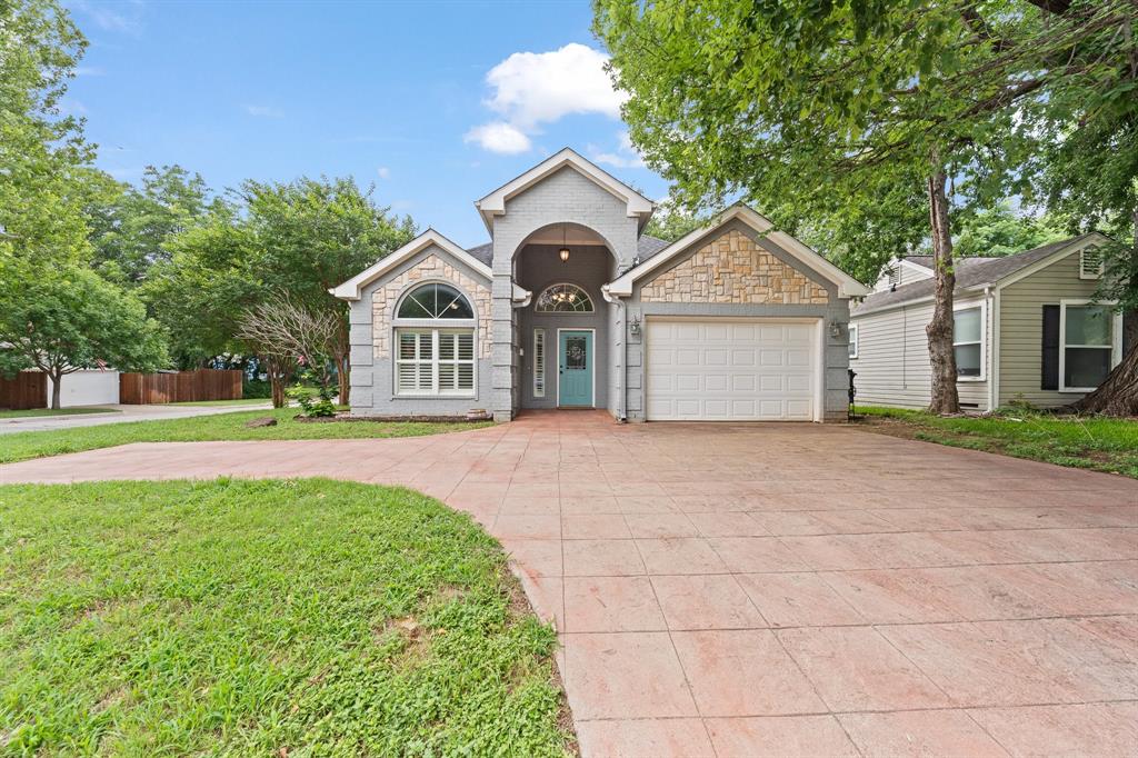 Welcome to this beautifully maintained 4-bedroom, 3-bathroom home situated on a desirable corner lot in the heart of Arlington Heights, just minutes from Dickies Arena, Fort Worth's premier dining destinations, shopping, and entertainment. Inside, you'll find fresh interior paint, spacious living and dining areas, and an inviting floor plan designed for both everyday living and entertaining. The chef-inspired kitchen is the centerpiece of the home, featuring abundant cabinet storage, granite countertops, a large center island, stainless steel appliances, a gas range, built-in desk area, and a generous cabinet pantry. The private primary suite offers a recently updated bathroom, creating a stylish and relaxing retreat with dual sinks and shower heads. Additional highlights include a large utility room with shelving, a convenient mud bench area, and ample storage throughout. Other upgrades include spray foam insulation, tankless hot water heater,  HVAC upgraded in 2024, electrical outlet for electric car charging, and plantation shutters throughout the home. Step outside to enjoy the low-maintenance backyard complete with turf and an updated 8-foot privacy fence, providing the perfect space for relaxing, entertaining, or play. Combining modern updates, functional spaces, and an unbeatable location near Dickies Arena and some of Fort Worth's best restaurants, this Arlington Heights gem is one you won't want to miss.