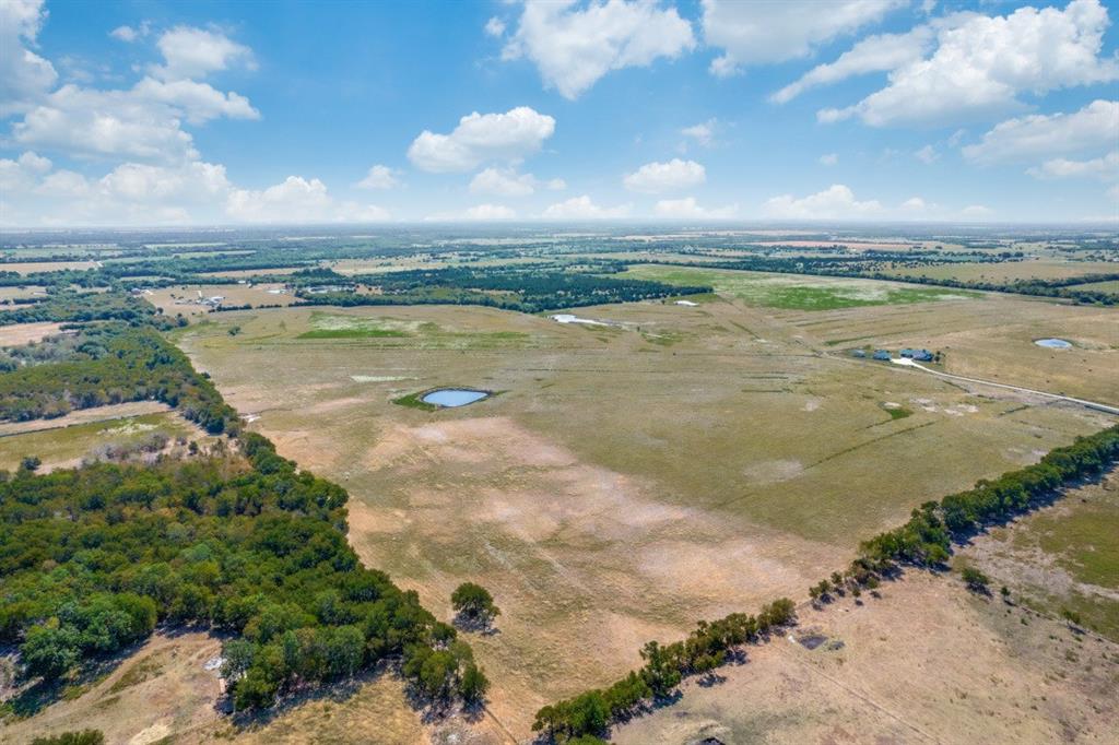 Rare, stunning 335 acre property NE of Dallas with tons of possibilities! The Smith Ranch is a gorgeous piece of property with fenced and cross-fenced pastures and rolling hills.  This ag-exempt acreages features 6 ponds and approx. 1700 feet of FM 1566 road frontage.  Build your dream home on the hilltop with a full view of the property in every direction.  Enjoy the country, quiet life but make it to Greenville in 15 minutes or McKinney in 45 minutes.
