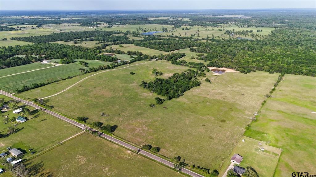 Land lots of Land! This is your chance to own 295 acres of prime East Texas land in the Ben Wheeler area, located within the outstanding Martin’s Mill School District. The property offers a fantastic combination of hardwood timber and approximately200 acres of improved coastal pasture, perfect for hay production, livestock, or recreation. A picturesque pond provides a peaceful setting and a water source for livestock or wildlife. A comfortable 3 bedroom, 2 bath home, ideal as a primary residence, weekend retreat, or ranch headquarters Four strand barbed wire fencing around the property A well on site, County road frontage for easy access. This is a turn key property with everything you need for ranching, recreation, or investment. The mix of open land and wooded areas offers privacy, productivity, and potential in one exceptional package.