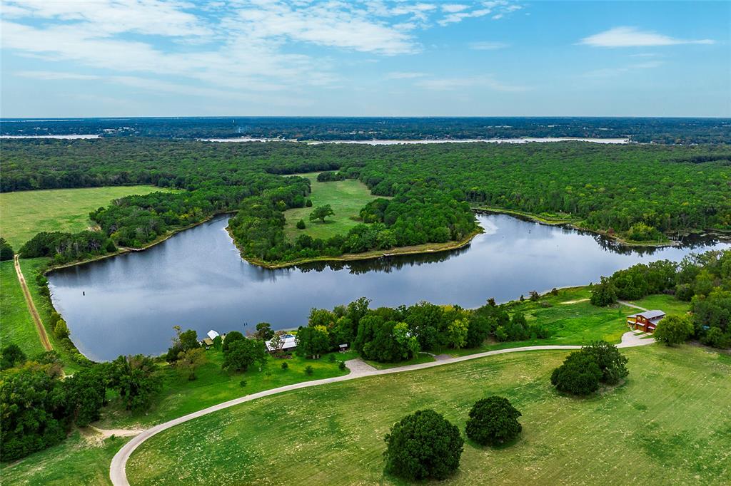 PRIVATE 34 ACRE LAKE & PRISTINE RECREATIONAL RANCH 
LOCATED 1 HOUR FROM DALLAS

Private and pristine recreational ranch estate nestled on 312 acres. The serene setting provides rejuvenation from city noise located 1 hour outside Dallas. Mature burr oaks and magnificent old-growth pines are abundant throughout the ranch. Several trails traverse the property including a well-stocked 34-acre lake and boat dock.  A huge, unencumbered sky view offer a haven for stargazers. A rare and very special place for your secondary home or family compound. 

Luxury Amenities
• Main house, Clubhouse, Guest Cabin
• Barn with full kitchen and living quarters.
• Infinity pool and spa
• 34 AC Private Lake
• ATV, Tractor
• Outdoor living 

Additional Property Features:
• Fishing: bass, crappie, catfish 
• Boat dock
• Pickle Ball space (not installed yet)
• Outdoor fireplace and grill