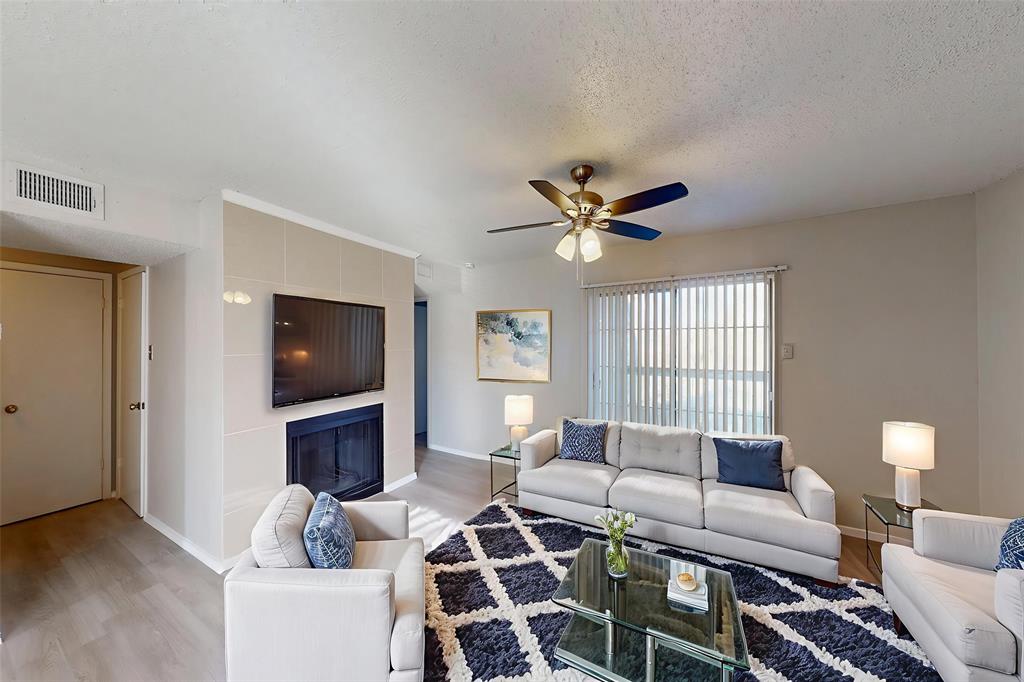 Welcome to this beautifully updated 2-bed, 2-bath condo located in the heart of Dallas near the major highways 75 and 635. This home offers exceptional convenience with easy access to shopping, dining, and everyday commute, as well as close proximity to Dallas College. Recent upgrades enhance the modern appeal of the home, including new luxury vinyl flooring throughout unit and elegant ceramic tile in the bathrooms. The spacious living room features a cozy wood-burning fireplace, creating a warm and inviting atmosphere. The updated kitchen comes fully equipped with brand-new appliances, including a microwave, electric range, dishwasher, and a stainless steel refrigerator—ideal for both daily living and entertaining. A new water heater, still under manufacturer warranty, provides added peace of mind. Both bedrooms are generously sized with walk-in closets and designed for comfort & privacy, making the layout ideal for families or roommates. Large windows allow abundant natural light to fill the space. Additional features include a dedicated carport and a private balcony overlooking a serene green area, offering a quiet retreat in a prime urban location. This move-in-ready condo combines modern upgrades, a functional layout, and unbeatable access to everything Dallas has to offer.