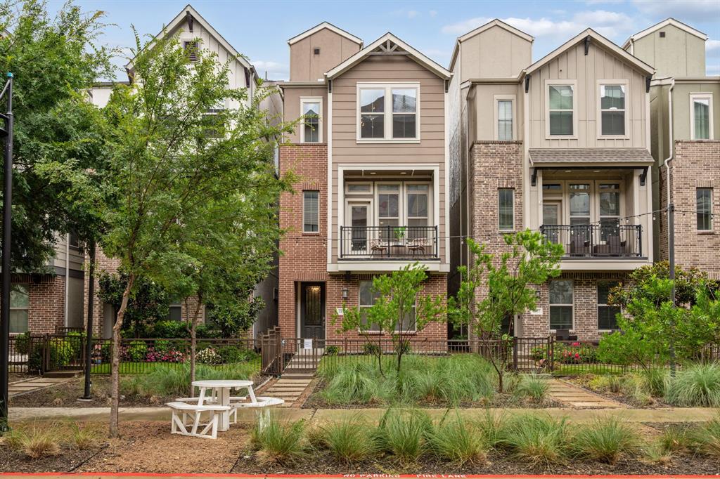 City skyline views, a rooftop patio, and a location that places some of Dallas' most exciting destinations within minutes. This 3-bedroom, 3.5-bath home offers four levels of thoughtfully designed living and modern style. The first floor features a private guest bedroom and full bath, creating flexibility for visitors, a home office, or a quiet retreat separate from the main living spaces. Natural light fills the open-concept second floor, where the living, dining, and kitchen areas come together in a layout designed for both entertaining and daily life. The eat-in kitchen showcases a contemporary geometric backsplash, stainless steel appliances, expansive granite countertops, and abundant prep space. Just off the living area, a private balcony offers the perfect spot to enjoy your morning coffee or unwind in the evening. A convenient half bath completes the level. Upstairs, the third floor is dedicated to comfortable living with a spacious primary suite, secondary bedroom, full bath, and laundry room. The fourth-floor rooftop patio delivers sweeping views of the Dallas skyline, creating an outdoor space that feels like a private escape in the city. Whether hosting friends or enjoying a quiet evening under the lights, it's a feature that sets this home apart. Residents enjoy access to a community pool, private parking, and beautifully maintained green spaces. Ideally located near Trinity Groves, the future Harold Simmons Park, and SoHo Square Lagoon, this home also offers convenient access to Oak Cliff, Bishop Arts District, Deep Ellum, Uptown, and the Margaret Hunt Hill Bridge. UT Southwestern, Children's Medical Center, and Methodist Dallas Medical Center are all within a 10-minute drive, making this an exceptional opportunity to enjoy connected city living with room to relax.