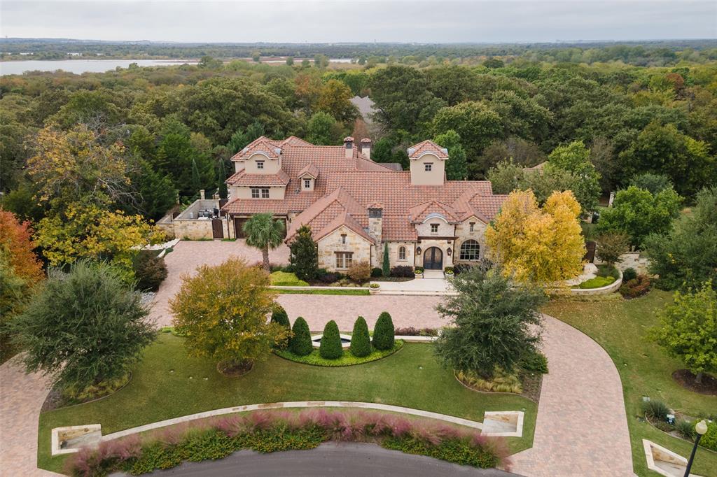 Exquisite Estate, nestled among mature trees is situated in the sought-after Chimney Rock subdivision, a premier Flower Mound Conservation Neighborhood with horse trail access, stunning greenbelts and walking trails! 1 ACRE LOT! Flower Mound schools & just minutes to Liberty Christian School! Elegant home features breathtaking views, grand scaled reception rooms, intimate family spaces, lavishly painted ceilings, venetian plastered walls, 7 Fireplaces, 68 KW Generator, Aqua link controls, sound & lighting systems! Palatial Living spaces w-exquisite finishes & details, oversized windows bring in natural light! Gourmet Chef's Kitchen, Private Master Retreat w-spa bath! Great sized guest bedrooms, Media & Game Rooms + Formals! Remarkable Backyard Retreat w-approx 3,926 SF of outdoor living space, verdant landscaped grounds, multiple patio areas, resort style pool, grand firepit, outdoor kitchen + KOI pond! 4 car garage! Great Location, quick access to DFW Airport, Southlake & Westlake!