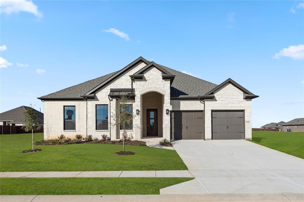 MLS# 20754111 - Built by Sandlin Homes - Ready Now! ~ Our Westwood plan with 4 bedrooms, 2.5 bathrooms, a barrel ceiling entryway, beamed ceilings in the great room, and an oven tower. This home is designed with 3cm quartz countertops, white and green painted cabinets, black trim windows, carpet, upgraded tile and engineered hardwood flooring, and a tiled fireplace!