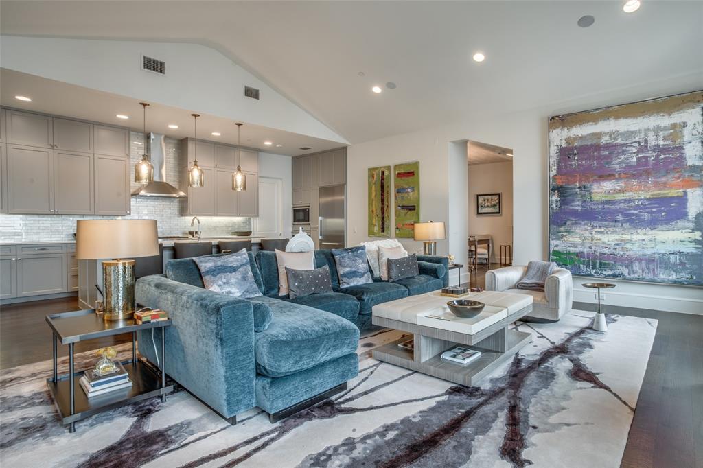 The Mondara offers a luxurious and sophisticated living environment, embodying a hassle-free, lock-and-leave lifestyle. This exquisite top-floor unit features soaring vaulted ceilings, beautiful hardwood floors, an abundance of natural light, and updated designer details that enhance its overall charm. Nestled in the heart of Highland Park, with the Katy Trail and Knox Street just steps away, this property seamlessly combines elegance and convenience. The Chef's Kitchen is a masterpiece, showcasing quartz countertops and an oversized island perfect for entertaining. An office space and a private terrace overlooking the serene courtyard. The Master Suite is a sanctuary, boasting a spacious walk-in closet, and a spa-like bathroom, ensuring your utmost comfort. Distinguished by its tasteful designer touches and treatments, this sleek condo offers an all-encompassing living experience.
