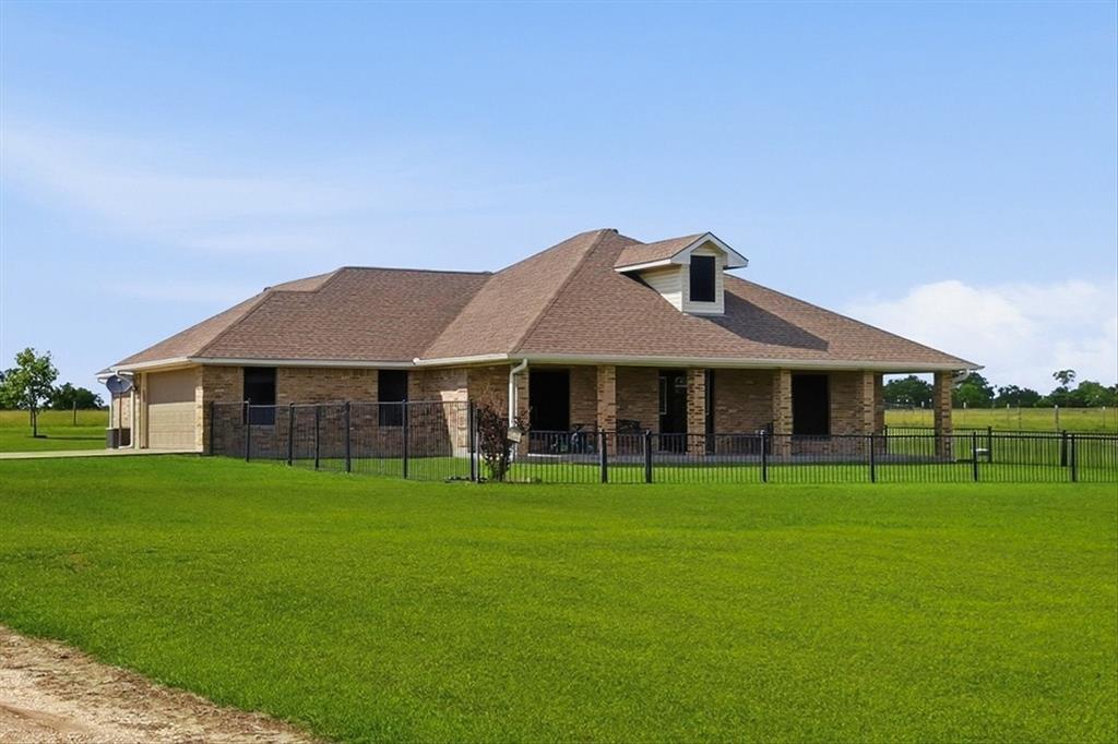Escape to peaceful country living on this beautiful 10-acre property in Terrell, a growing small-town community known for its wide-open spaces, farming roots, and convenient access to the Dallas metroplex. With plenty of room to spread out while still being within commuting distance of Dallas, Terrell offers the perfect blend of rural charm and everyday convenience.

The 2,099 SF ranch-style home features 3 bedrooms and 3.1 baths, along with a long private driveway that sets the home back from the road for added privacy and quiet surroundings. The home offers two spacious primary bedrooms, each with its own private bath. One suite features a walk-in jetted Jacuzzi tub, handicap accessible sinks, and a walk-in closet. The second primary suite includes a fireplace, walk-in closet, tub with separate stand-up shower, and private access to the enclosed covered patio and courtyard overlooking the beautiful pastures.

The acreage is cross-fenced and currently set up for goats, making it ideal for hobby farming, livestock, or anyone looking to enjoy an agricultural lifestyle. Approximately 9 acres are ag exempt, offering significant property tax savings as long as the agricultural use is maintained. Purchase the existing goat business and continue the ag exemption already in place.

Additional improvements include a detached workshop with a two-car garage door, perfect for extra vehicle storage, equipment, hobbies, or workspace needs. The property also includes a large chicken coop, open pastureland, and plenty of space for horses, cows, gardening, or future expansion. Enjoy fresh fruit right from your own peach, plum, and pecan trees while taking in the peaceful country setting. Goats, guard dogs, chickens and select farm equipment is also available for purchase separately.