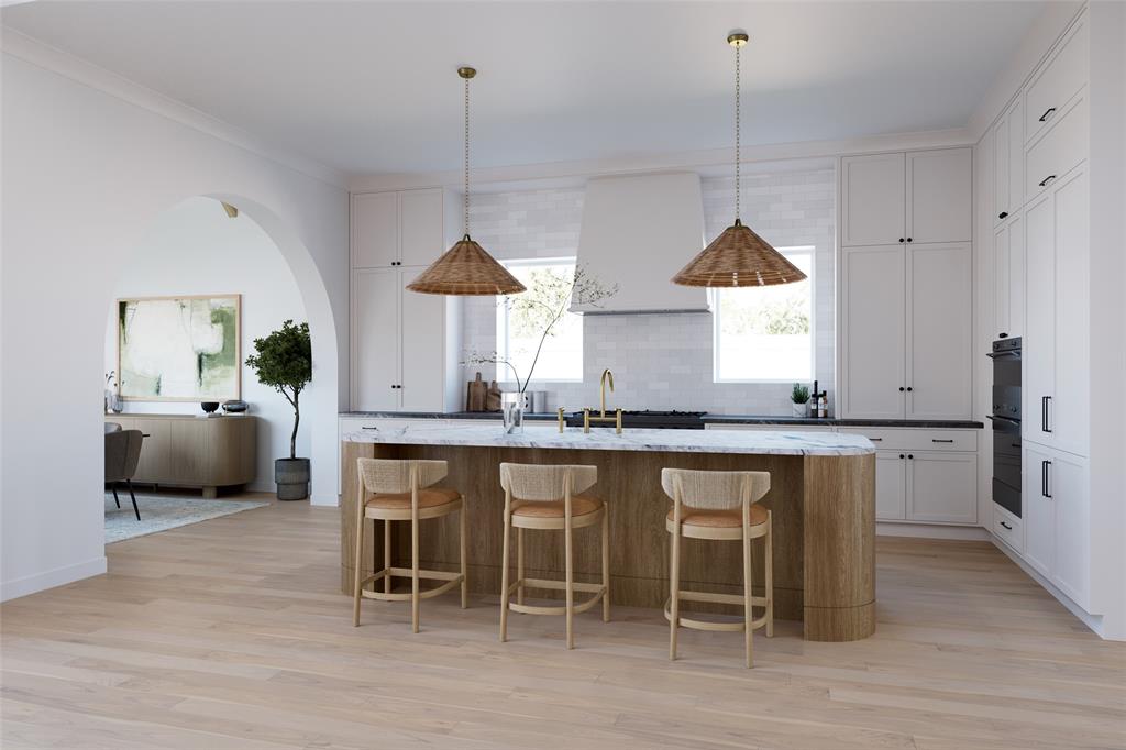Designed by Jessica Koltun Home, this exceptional residence offers 4 bedrooms, 4 full bathrooms, 2 powder baths, and 4,937 square feet of thoughtfully designed living space where timeless architecture meets modern sophistication. Every space has been carefully considered to create a home that is equally suited for elegant entertaining and everyday living.

A dramatic entry introduces soaring ceilings, expansive windows, and an abundance of natural light that highlights the home's clean architectural lines and curated finishes. The open-concept living spaces flow effortlessly into a chef's kitchen featuring custom cabinetry, premium appliances, an oversized island, and designer-selected materials that serve as both a striking focal point and functional gathering space.

The spacious primary suite provides a private sanctuary with a spa-inspired bath, generous walk-in closet, and a serene atmosphere designed for relaxation. Three additional bedroom suites offer exceptional comfort and privacy, while two powder baths provide added convenience for guests. Every detail, from custom millwork and architectural archways to layered textures and statement lighting, has been thoughtfully curated to create a cohesive and elevated aesthetic.

Designed for seamless indoor-outdoor living, the home offers inviting entertaining spaces that extend beyond the interior, while its timeless design and exceptional craftsmanship reflect the signature style synonymous with Jessica Koltun Home.