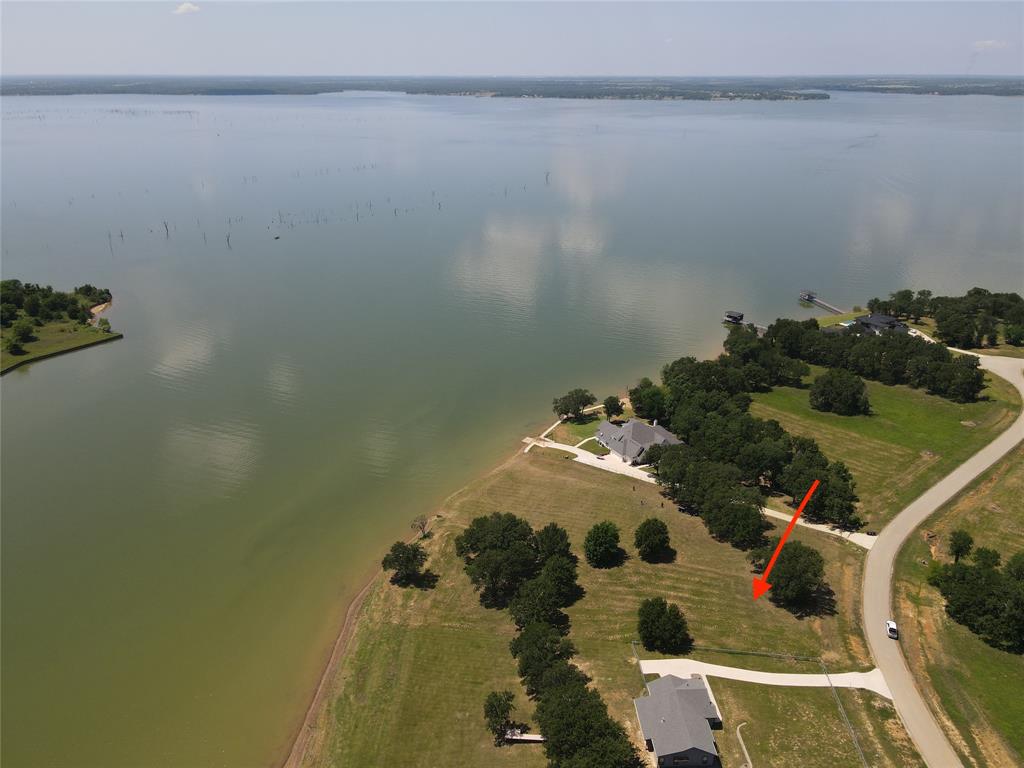 Build your dream home in Admiral Shores on Richland-Chambers Lake. The 3rd largest lake in Texas is perfect for fishing and water sports. Just off of I-45, about 1.5 hr southeast of DFW and 2.5 hours from Houston or Austin. This gated community features paved roads, a private boat launch, boat slips, a park area, and plentiful wildlife in this serene environment to live and play at your new lake home. Lot 64 offers open-water views, nestled on the edge of Paradise Cove, just off open water without compromising the views, while offering protection from heavy waves. This 1-acre property features a gradual slope to the water, ample build-to-site area, and a North-west-facing orientation for gorgeous sunsets. Take a trip to the lake to explore your new lake-home opportunity.