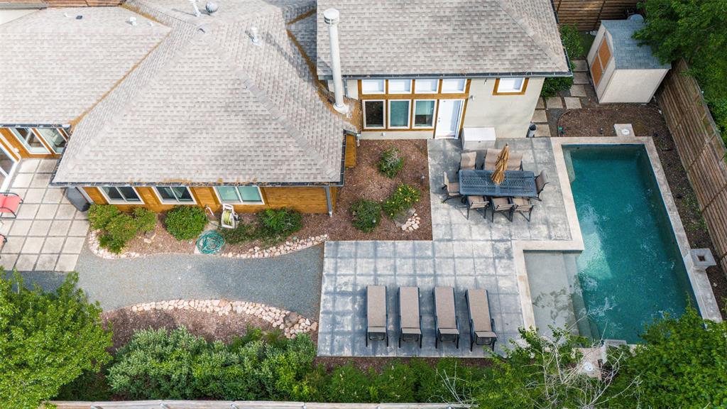 Redesigned and taken to the studs in 2015, this urban jewel beautifully blends modern and rustic finishes to offer a unique living experience designed for both functional living and lavish entertaining. Upon entering, you are greeted by an art gallery style entrance and a versatile flex space perfect for an art exhibit, study, or play area. The home features a chef’s kitchen equipped with a commercial 6 burner gas cooktop, an oversized Carrera marble island, and a convenient coffee bar. The main floor includes a private outdoor oasis with a pool, as well as two bedrooms, including one of two primary suites and a third ensuite bedroom that could easily serve as an office. Upstairs, a second primary suite and a large living area provide ample space to spread out. The location is exceptional, offering close proximity to Love Field, UT Southwestern, Parkland, and Children’s Medical Center. With easy access to the train for commutes to downtown or DFW Airport, and plenty of nearby shopping and dining, this home stands out for its design and convenience.