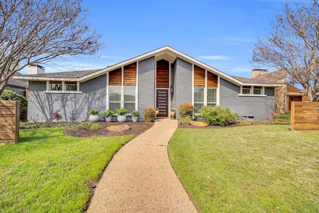 Remodeled and thoughtfully reimagined, this modern retreat is a standout opportunity in highly sought-after Preston Port Estates, zoned to acclaimed Brentfield Elementary in Richardson ISD. Offering 3 bedrooms, 2.5 baths, plus a separate office or guest room with a Murphy bed that conveys, this home blends mid-century charm with elevated, contemporary design in a way today’s buyers crave. From the moment you arrive, the curb appeal makes an impression with sleek modern wood accents and fresh landscaping. Inside, a light-filled, open floor plan welcomes you with a stunning wall of windows overlooking a private courtyard-style patio, creating a seamless indoor-outdoor connection. The living room is anchored by a dramatic floor-to-ceiling fireplace, complemented by a wet bar - perfect for effortless entertaining. The chef’s kitchen is both functional and beautiful, featuring custom cabinetry, granite and quartz surfaces, stainless steel appliances, a 6-burner gas cooktop, and a peninsula with additional seating, plus a bright breakfast nook for casual dining. The primary suite offers a peaceful retreat with dual vanities, separate closets, and a spa-inspired bath with floor-to-ceiling tile and walk-in shower. Two secondary bedrooms share an updated bath, while the dedicated office or flexible space for guests, work, or play. Step outside to enjoy exceptional outdoor living with a covered patio strung with twinkle lights - ideal for evening dinners, entertaining, or simply unwinding. The expansive grassy backyard offers plenty of room for kids to play or pets to roam. Additional highlights include light flooring throughout, 2023 roof, and fully paid-off solar panels. Perfectly positioned near major highways, shopping, dining, and entertainment, and feeding into Brentfield Elementary, Parkhill Junior High, and J.J. Pearce High School, this home offers the ideal combination of location, lifestyle, and design.