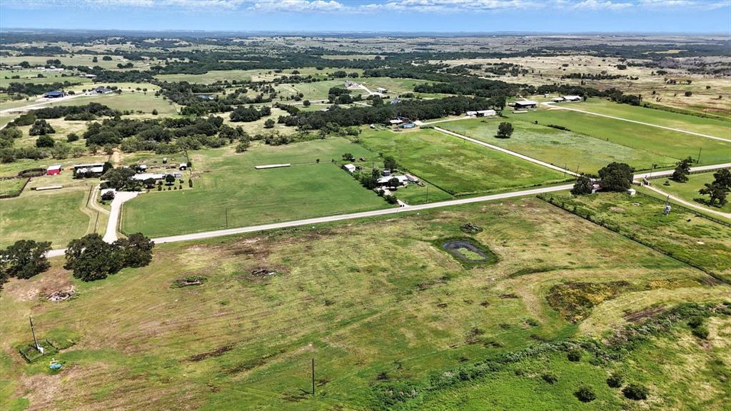 Welcome to Churchill Estates, a brand-new subdivision offering the perfect blend of peaceful country living and convenient access to nearby amenities. Located just 15 minutes from Granbury, this 2+ acre estate lot provides ample space to build your dream home, all while enjoying the serene sounds of the countryside without sacrificing proximity to shopping, dining, and entertainment. Nestled close to Lake Granbury and the charming Granbury Square, Churchill Estates offers the ideal retreat from city traffic with quick access to everything you need. This open, level lot boasts direct road frontage on Colony Road, with planned asphalt roads throughout the subdivision for easy access. Each homesite will require a private water well and septic system. Deed restrictions help protect your investment—available in the documents section or upon request from the listing agent. Photos depict the subdivision and are not lot-specific. Don’t miss your chance to be among the first to call Churchill Estates home!