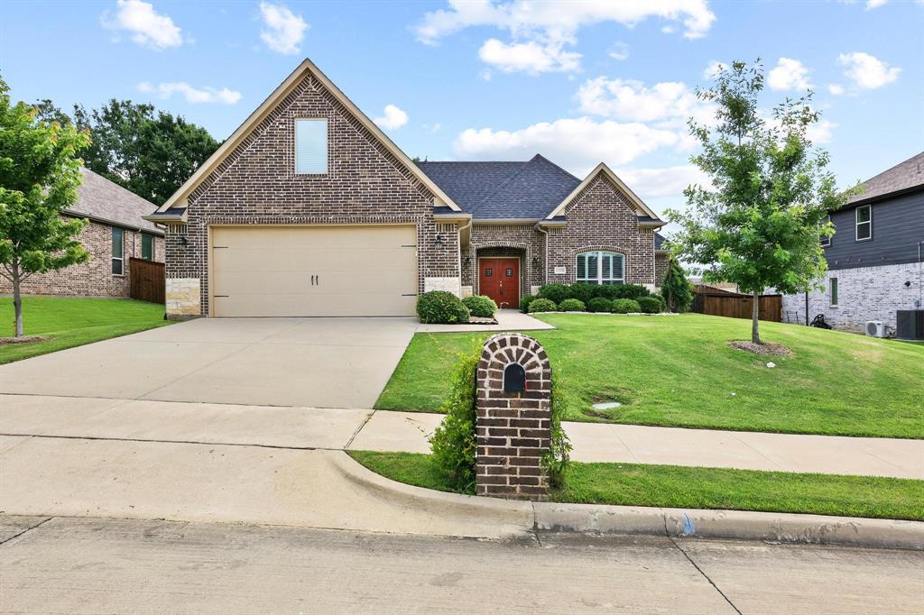 Welcome home to this beautifully designed home in the sought-after Gateway Village community, where modern finishes, thoughtful design, and an exceptional location come together to create a home you'll love coming back to every day.  Offering 3 bedrooms, 2.5 bathrooms, and 1,932 square feet of well-appointed living space, this home features a desirable split-bedroom floor plan that provides privacy and functionality. The spacious open-concept living area showcases recessed ceilings, crown molding, and a stunning Austin Stone wood-burning fireplace that creates a warm and inviting focal point.  The kitchen is designed to impress with quartz countertops, a tasteful tile backsplash, stainless steel appliances, a gas range, pantry storage, and ample workspace. The seamless flow between the kitchen, dining, and living areas makes everyday living both comfortable and convenient.  Just off the garage, the oversized laundry room offers abundant cabinetry, quartz countertops, a utility sink, and a convenient drop zone to help keep life organized.  The private primary suite serves as a relaxing retreat, featuring recessed ceilings, a spacious walk-in closet, and an ensuite bath complete with dual vanities, quartz countertops, and a large walk-in shower. Two additional bedrooms share a well-appointed bathroom with dual sinks and quartz countertops.  Step outside to enjoy a covered back patio overlooking a large privacy-fenced backyard, providing plenty of room for outdoor entertaining, gardening, pets, or simply relaxing after a long day.  Located in the desirable Gateway Village neighborhood, residents enjoy nearby walking trails, a playground, and a splash pad, while remaining conveniently close to shopping, dining, medical facilities, and major commuter routes.  With its modern design, quality finishes, spacious layout, and outstanding community amenities, this move-in ready home offers the perfect balance of comfort, style, and convenience.