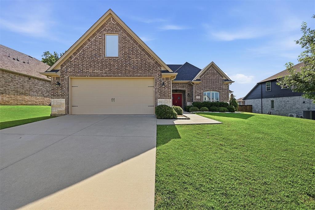 Welcome home to this beautifully designed home in the sought-after Gateway Village community, where modern finishes, thoughtful design, and an exceptional location come together to create a home you'll love coming back to every day.  Offering 3 bedrooms, 2.5 bathrooms, and 1,932 square feet of well-appointed living space, this home features a desirable split-bedroom floor plan that provides privacy and functionality. The spacious open-concept living area showcases recessed ceilings, crown molding, and a stunning Austin Stone wood-burning fireplace that creates a warm and inviting focal point.  The kitchen is designed to impress with quartz countertops, a tasteful tile backsplash, stainless steel appliances, a gas range, pantry storage, and ample workspace. The seamless flow between the kitchen, dining, and living areas makes everyday living both comfortable and convenient.  Just off the garage, the oversized laundry room offers abundant cabinetry, quartz countertops, a utility sink, and a convenient drop zone to help keep life organized.  The private primary suite serves as a relaxing retreat, featuring recessed ceilings, a spacious walk-in closet, and an ensuite bath complete with dual vanities, quartz countertops, and a large walk-in shower. Two additional bedrooms share a well-appointed bathroom with dual sinks and quartz countertops.  Step outside to enjoy a covered back patio overlooking a large privacy-fenced backyard, providing plenty of room for outdoor entertaining, gardening, pets, or simply relaxing after a long day.  Located in the desirable Gateway Village neighborhood, residents enjoy nearby walking trails, a playground, and a splash pad, while remaining conveniently close to shopping, dining, medical facilities, and major commuter routes.  With its modern design, quality finishes, spacious layout, and outstanding community amenities, this move-in ready home offers the perfect balance of comfort, style, and convenience.