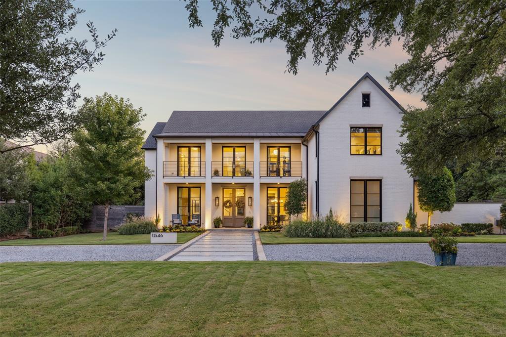 11546 W. Ricks Circle, Dallas, TX 75230 is a 7,158-square-foot custom, luxury estate built in 2017-18 by the renowned builder Ellen Grasso, set on an exceptional .88-acre estate lot on coveted Ricks Circle in the prestigious Preston Royal neighborhood near Preston Hollow. This 5-bedroom, 5.2-bath transitional brick-and-stucco residence blends clean architectural lines with timeless design, offering refined modern living in one of North Dallas’ most sought-after luxury neighborhoods, minutes from Dallas’ premier private schools and within Dallas ISD. Eleven-foot ceilings and expansive floor-to-ceiling windows fill the home with natural light, while oversized sliding doors in two spacious living areas create seamless indoor-outdoor flow to a screened porch with a vaulted ceiling and two-sided fireplace overlooking the resort-style backyard with heated pool, spa, and expansive lawn. The chef’s kitchen features Sub-Zero refrigerator and freezer, quartzite and quarters counters, Wolf double ovens and gas cooktop, warming drawer, two Bosch dishwashers, built-in Miele coffee system, two pantries, and a butler’s pantry connecting to the formal dining room and wet bar with Scotsman Sonic ice maker, beverage refrigerator, and climate-controlled wine storage. The downstairs primary suite offers a vaulted ceiling, corner windows with backyard views, private beverage center, and spa-inspired bath with heated floors, steam shower, dual water closets, and Ann Sacks tile. A guest suite, dedicated office, mudroom, and oversized utility room with built-in dog kennel and access to the separate, fenced dog run complete the first floor. Upstairs are a gameroom and three ensuite bedrooms including one which could be a private apartment-style suite with kitchenette, secondary washer and dryer, separate staircase access, and future elevator capability. Foam encapsulation, Savant smart home automation, three-car garage with EV outlet, and gated motor court enhance this luxury home.